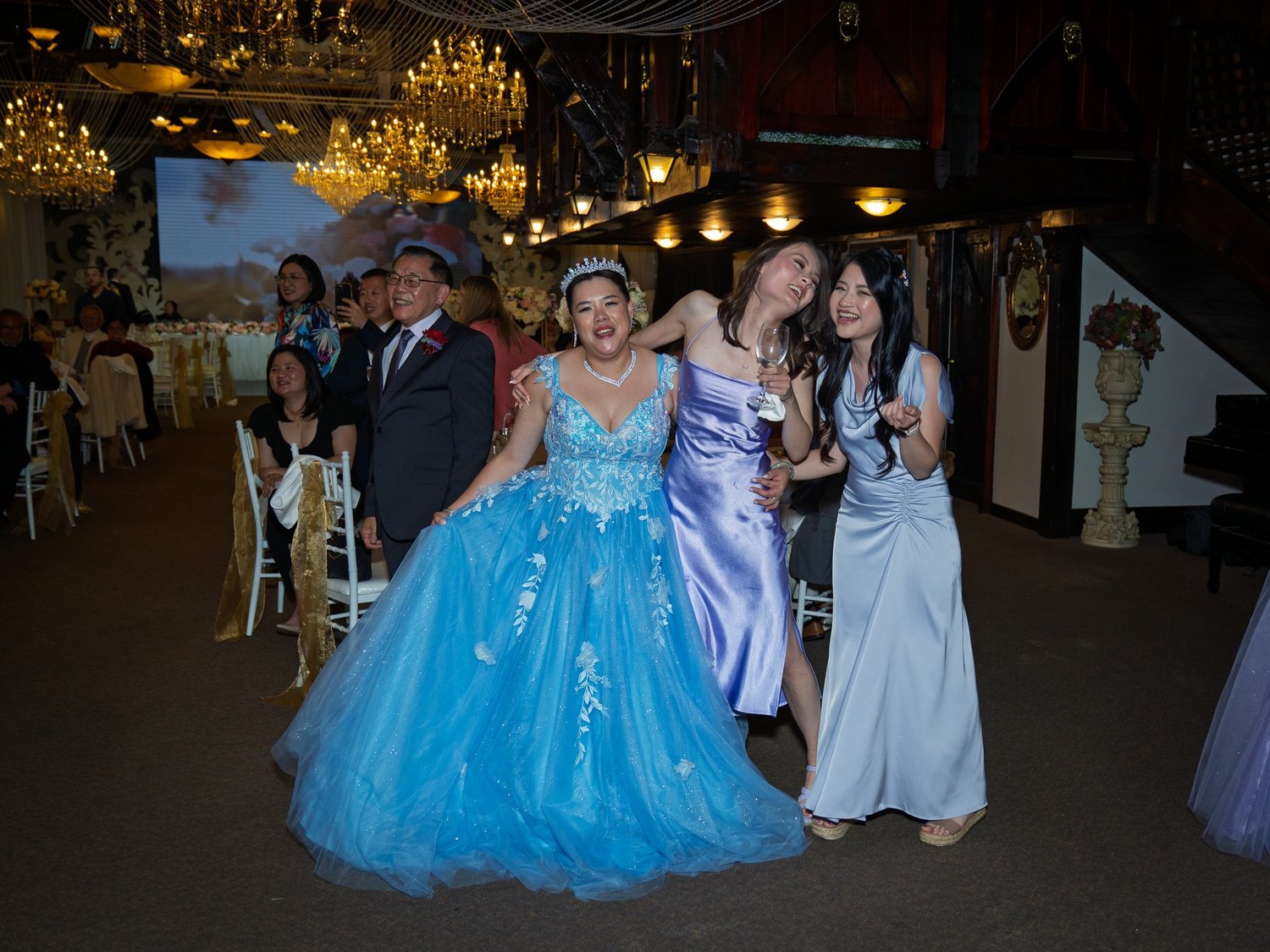 Stephanie in a blue tulle gown with guests
