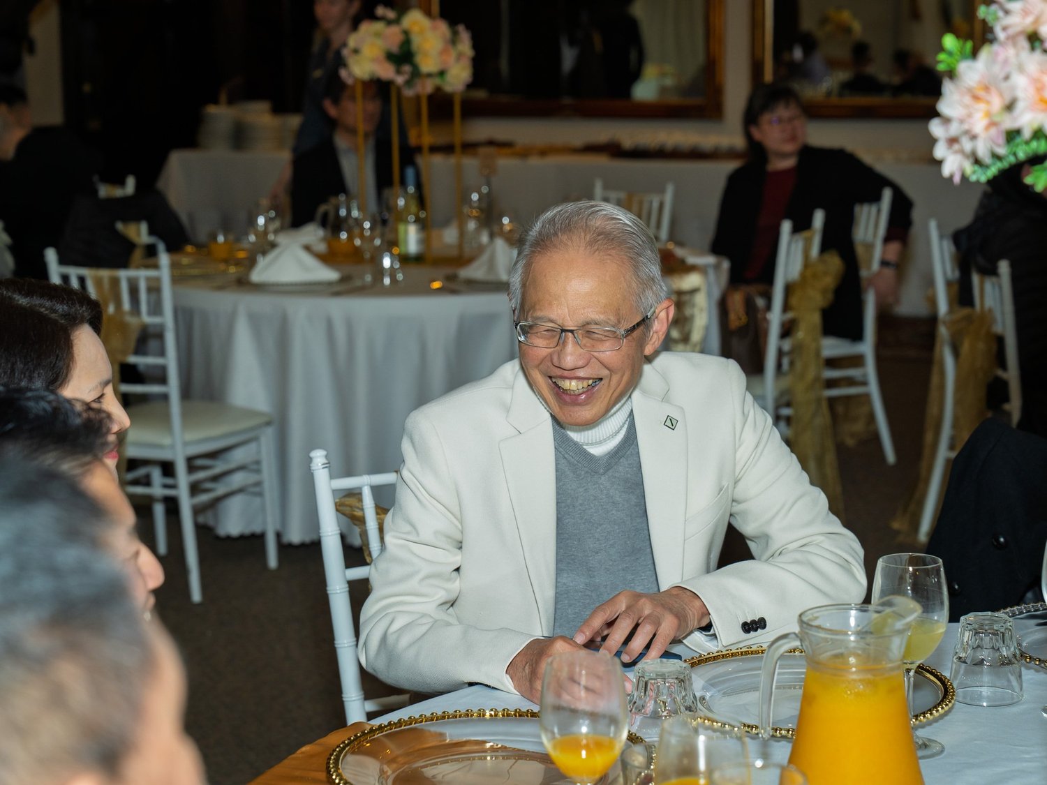 A guest laughs at his table