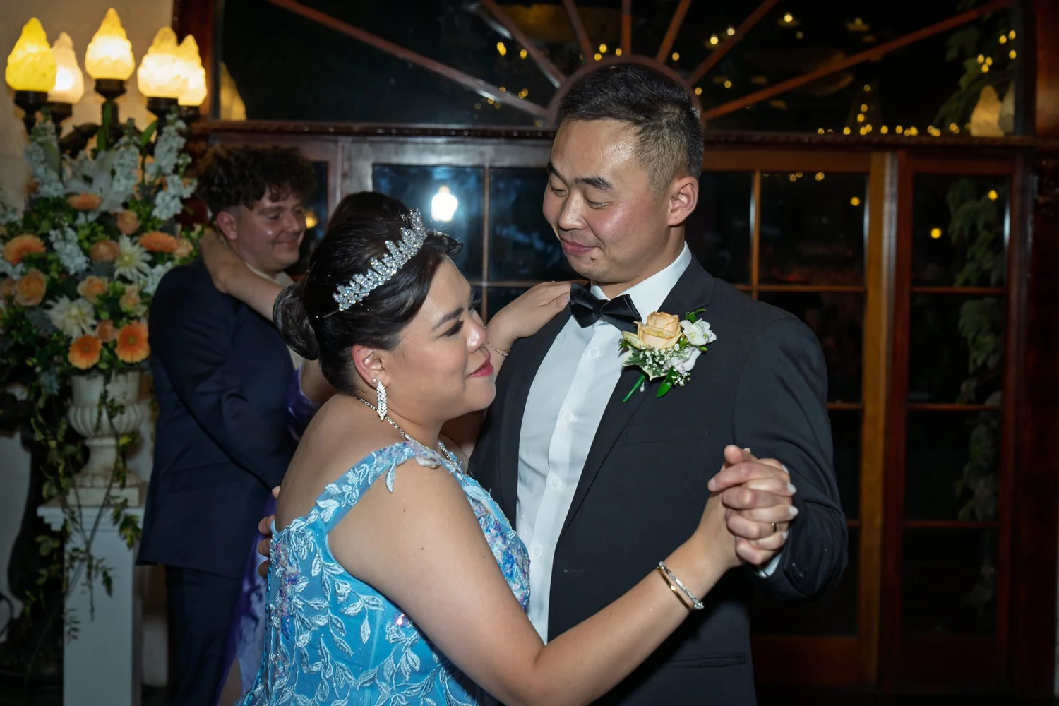 Stephanie and Jankai dance together in her blue gown