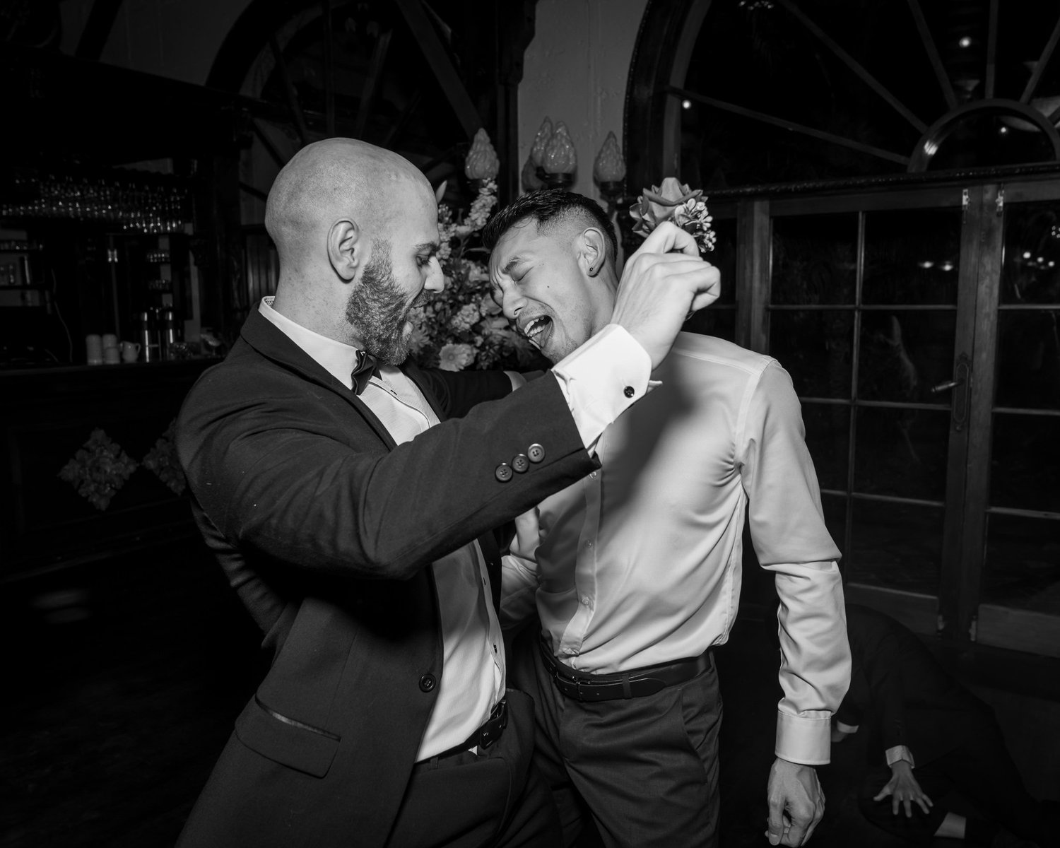 Black and white photo of guests dancing energetically