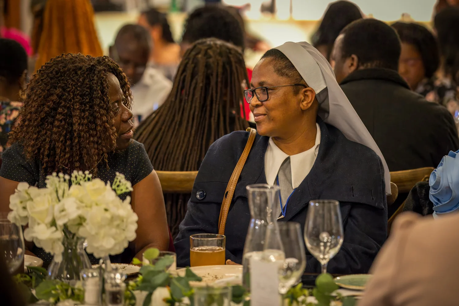 Guests listen to the speeches at their tables