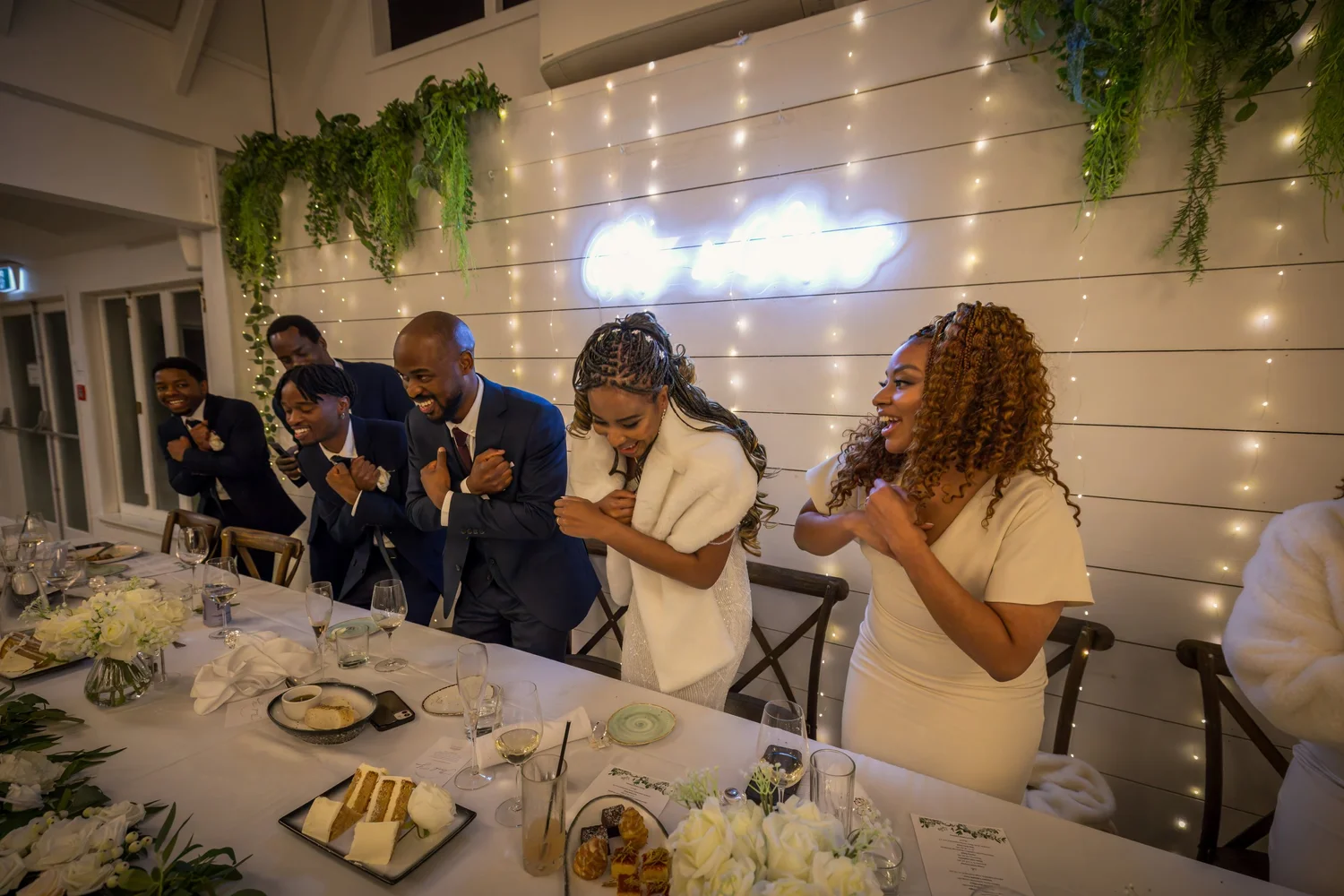 Guests dance and celebrate at the head table