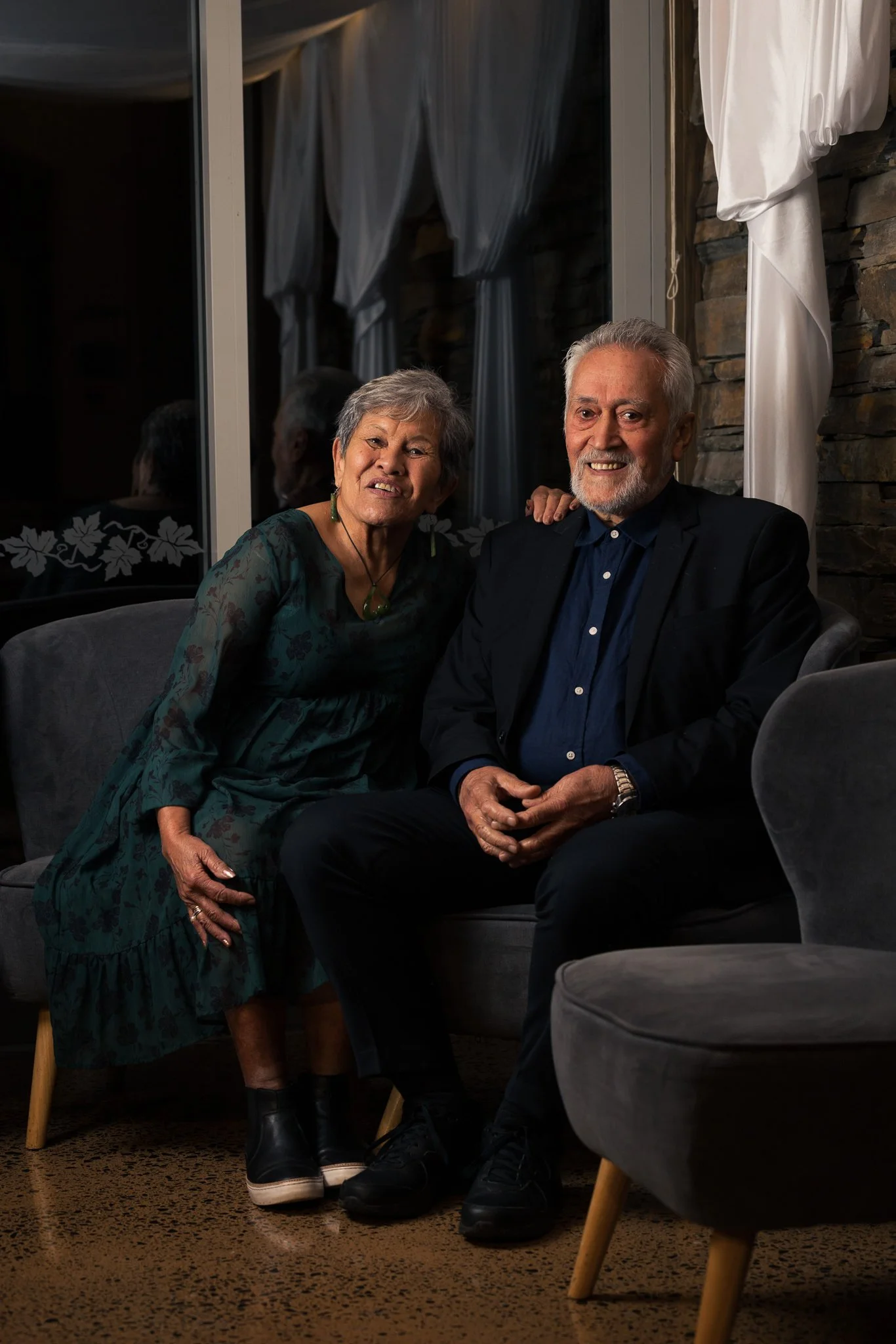 Two guests seated together for an evening portrait