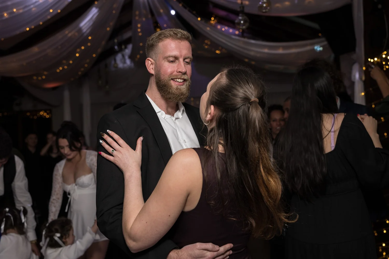 Guests dance on the dance floor