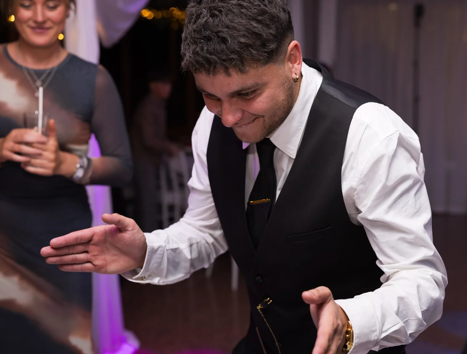 Connor dances with his arms out