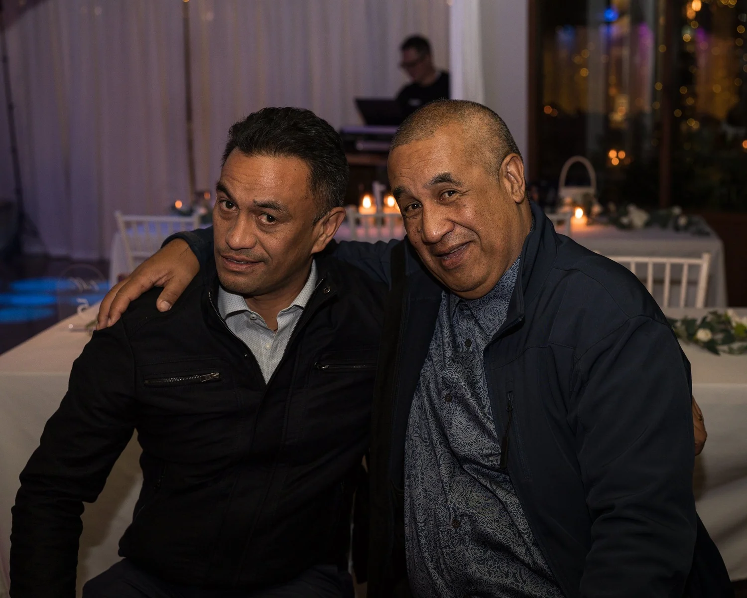 Two guests pose together on the dance floor