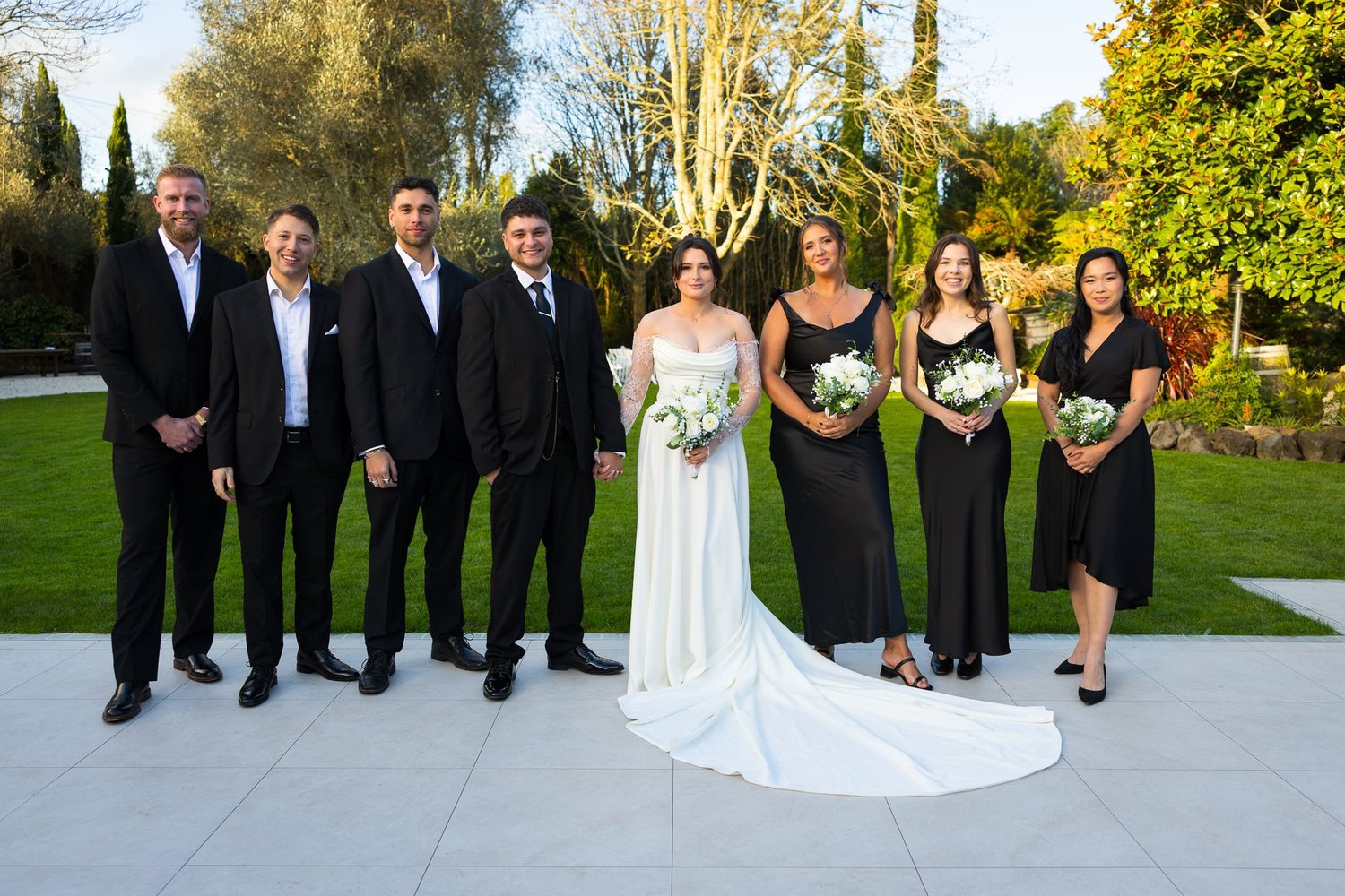 Paige and Connor with their bridal party on the terrace