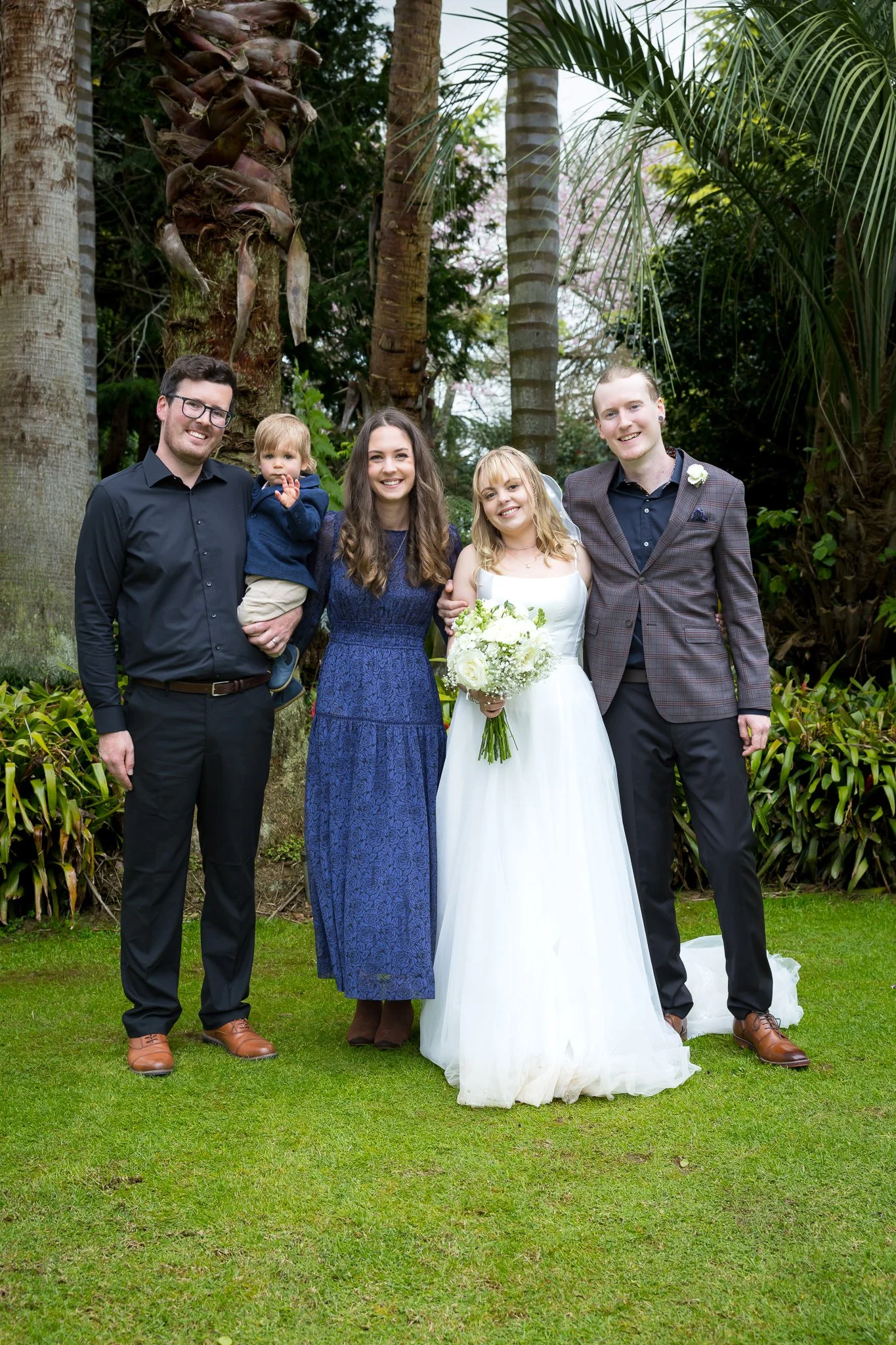 Shannon and Connor with family on the lawn