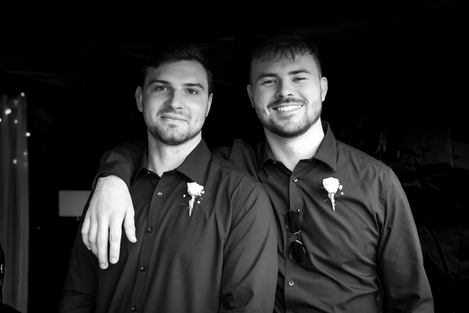 Black and white photo of two groomsmen