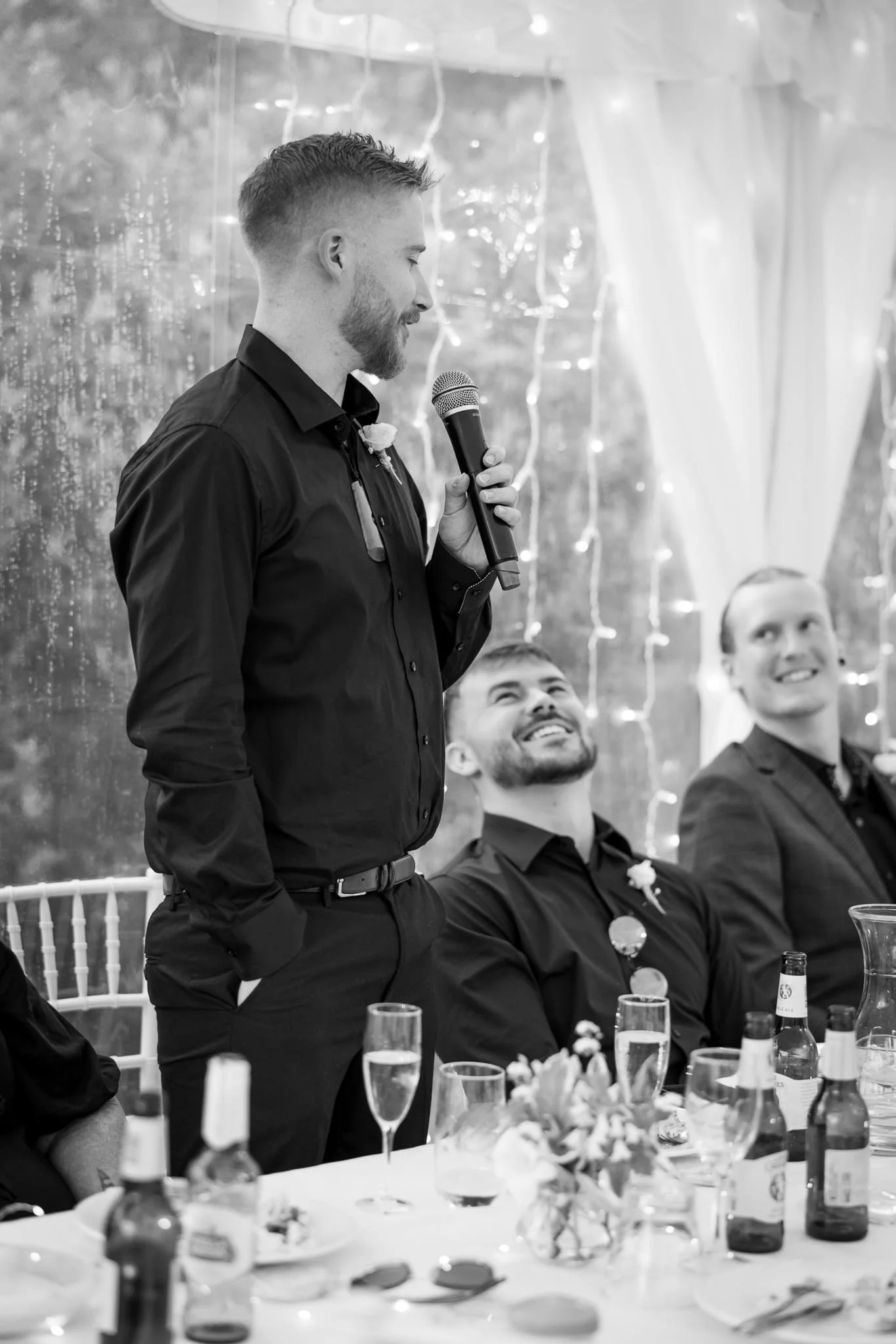 A groomsman gives a speech