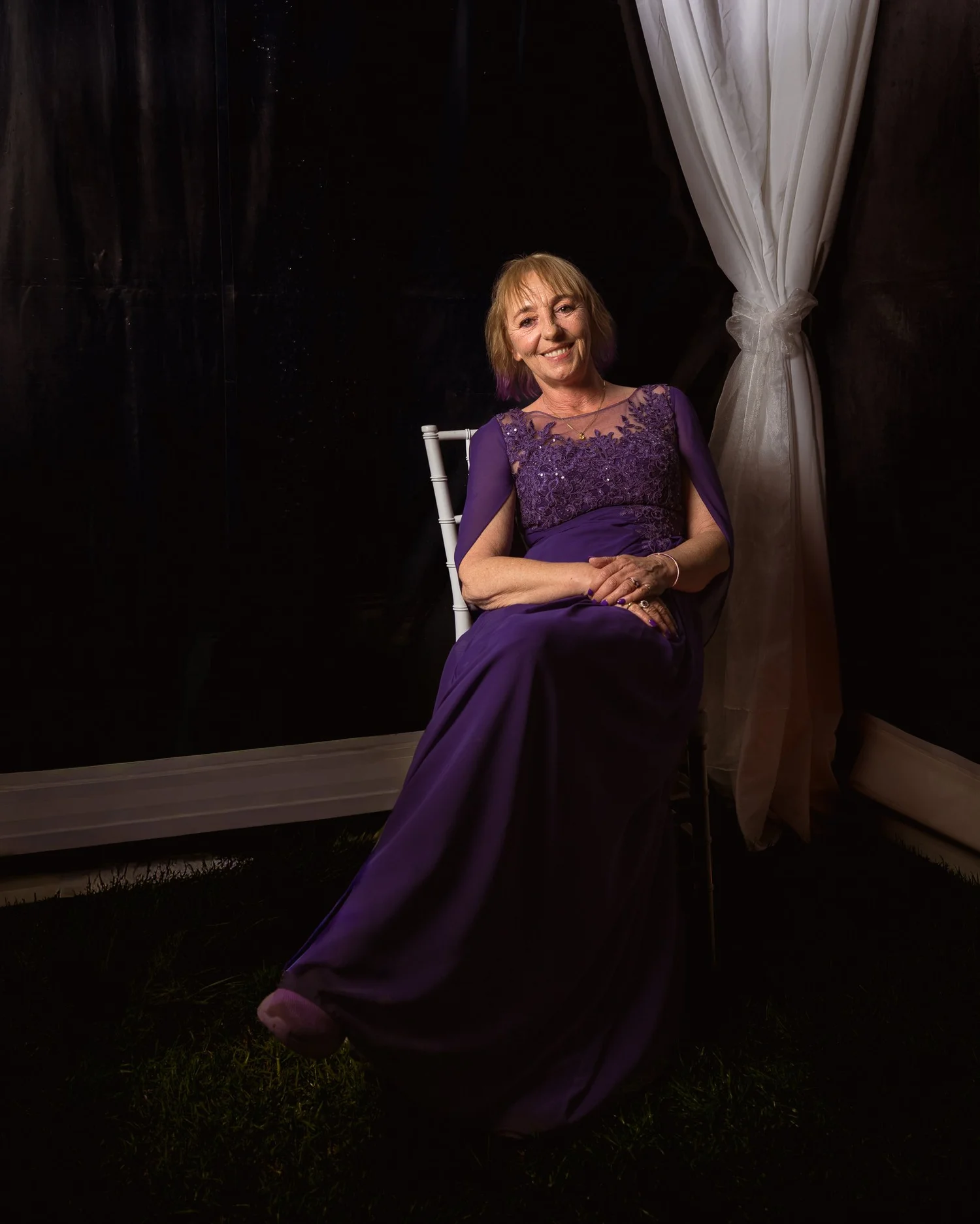 A guest in a purple gown for an evening portrait