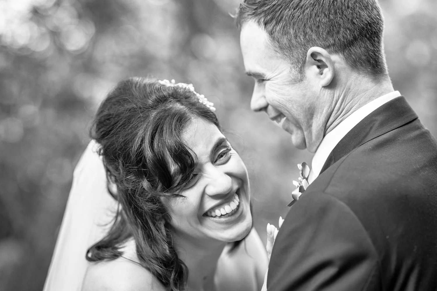 Black and white photo of Feby laughing with Steven
