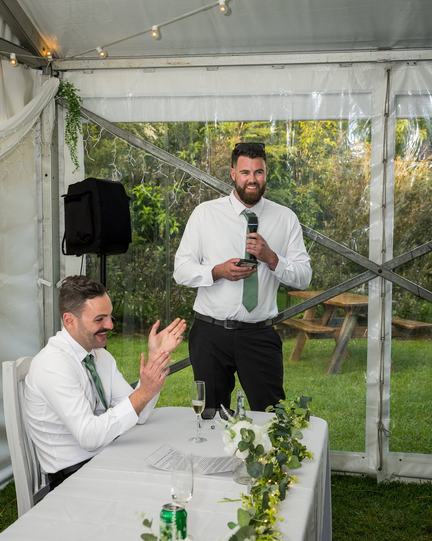 A guest gives a speech in the marquee