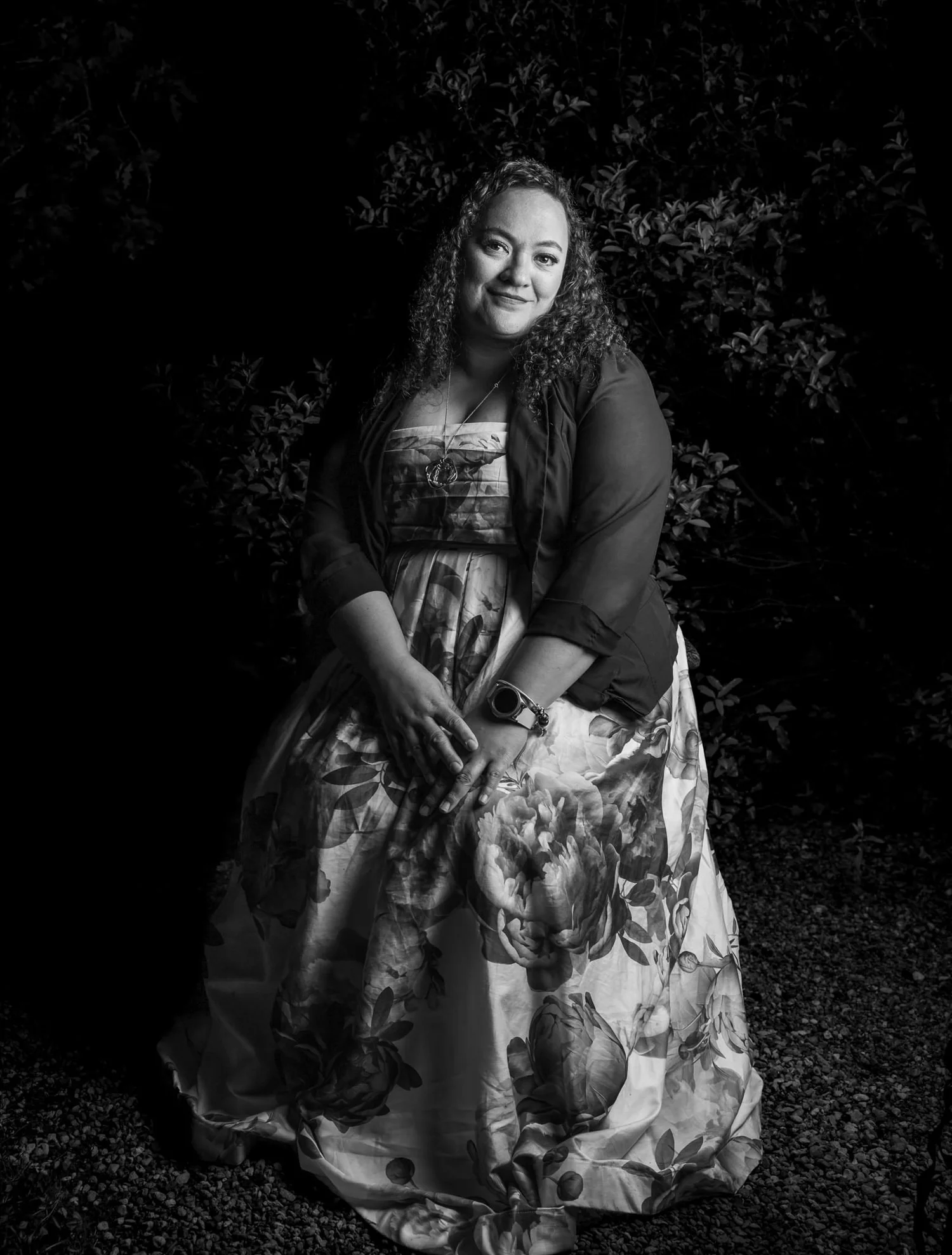 Black and white portrait of a guest in a floral dress
