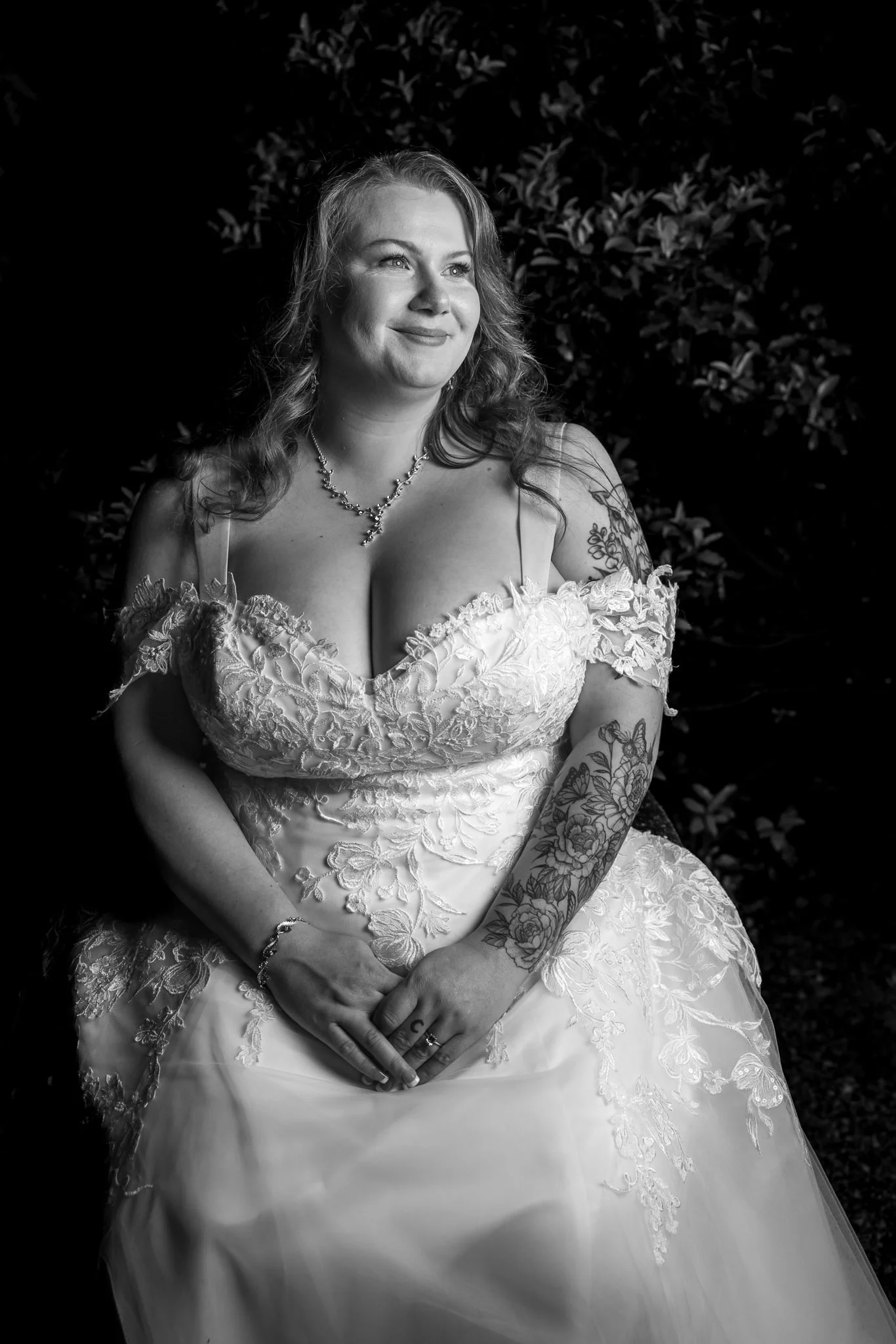 Black and white evening portrait of Janine in her gown