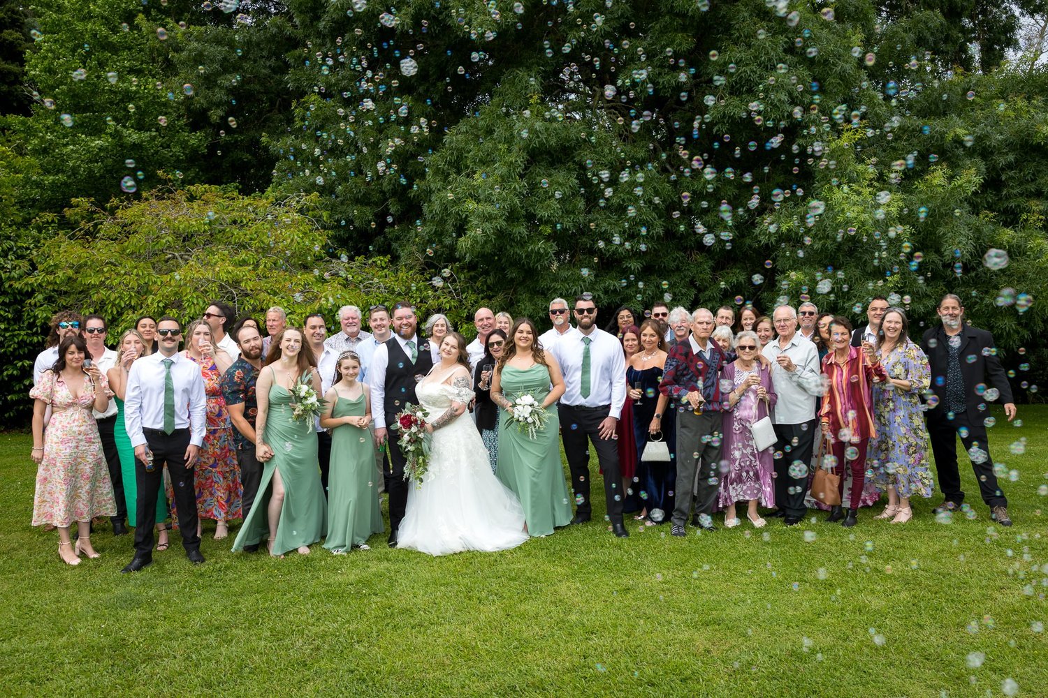 Janine and Kyle with all their guests on the lawn