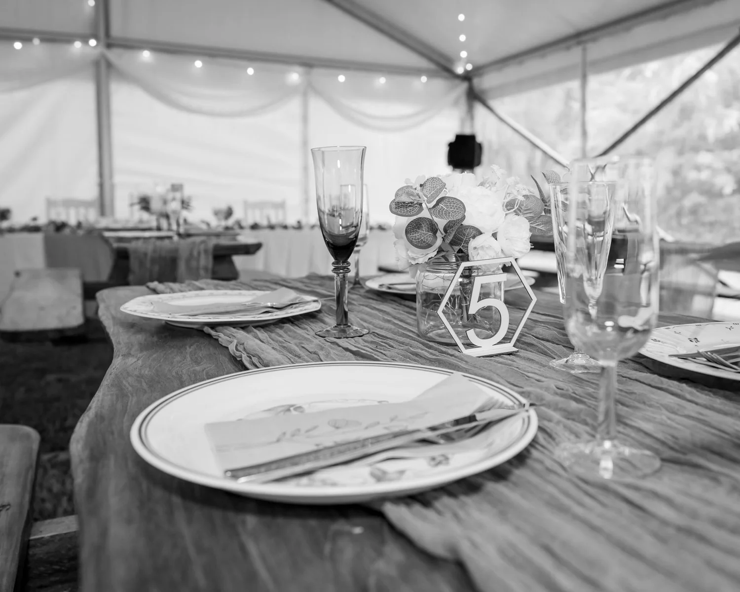 Black and white photo of a reception table setting