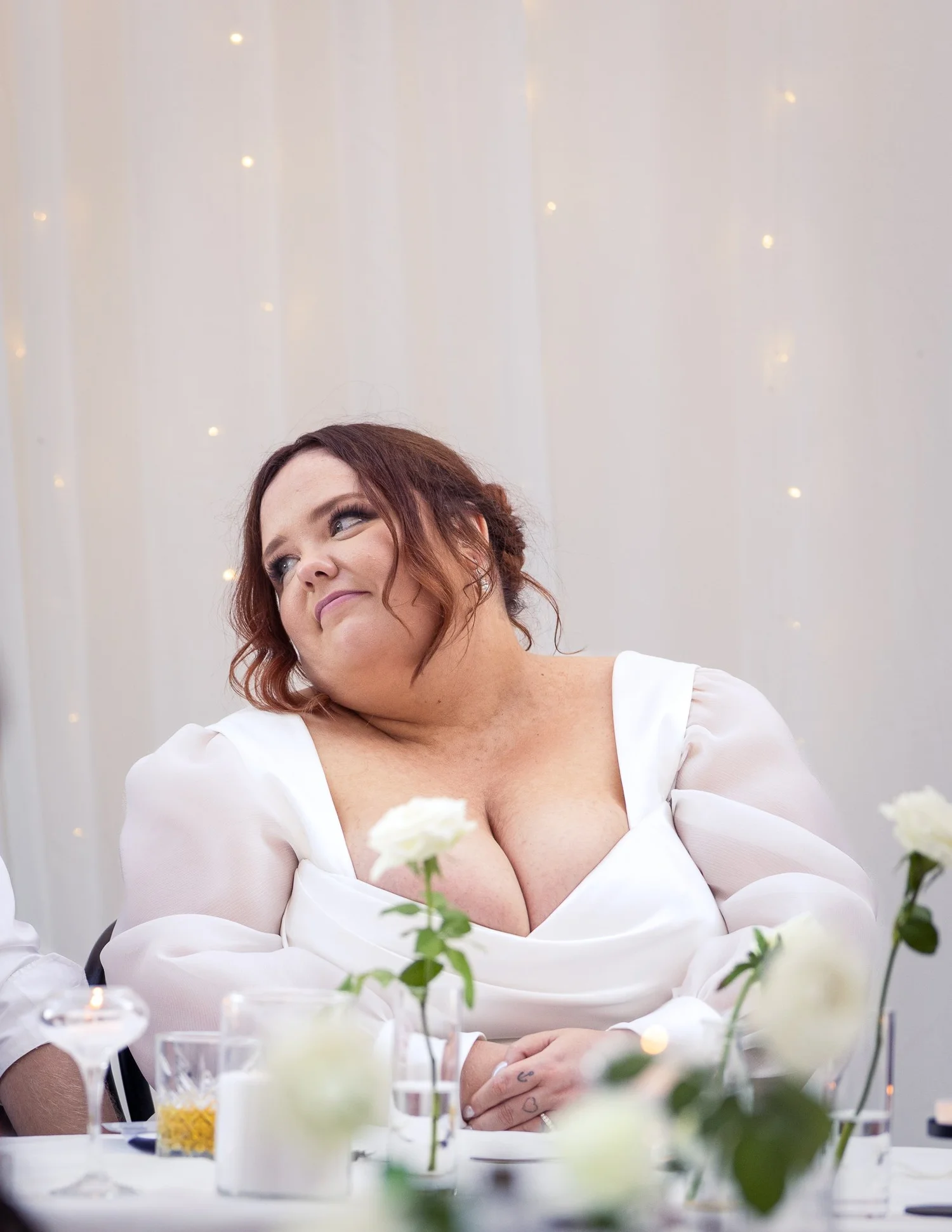 Leah laughs and looks up during the speeches