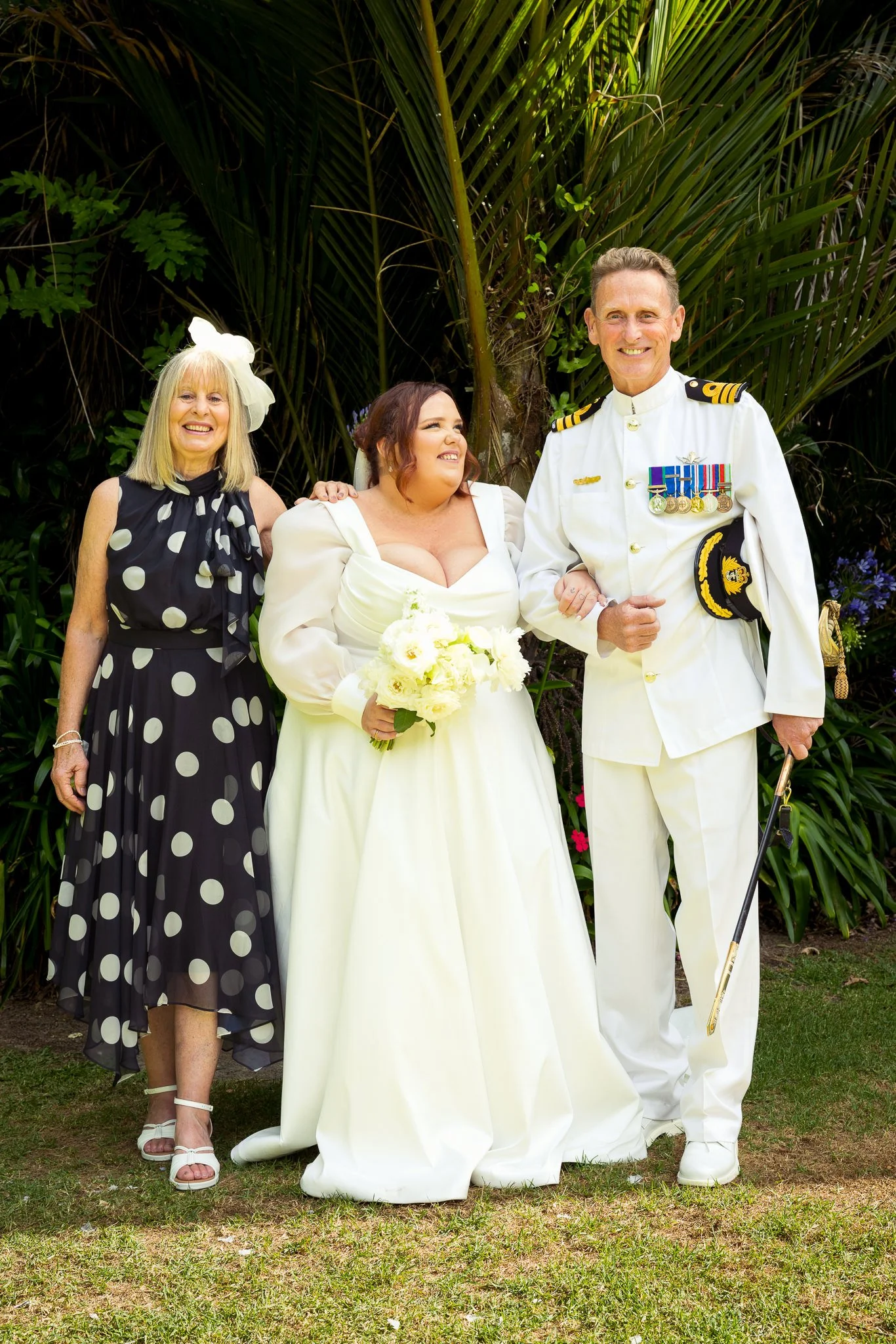 Leah with two guests on the garden lawn