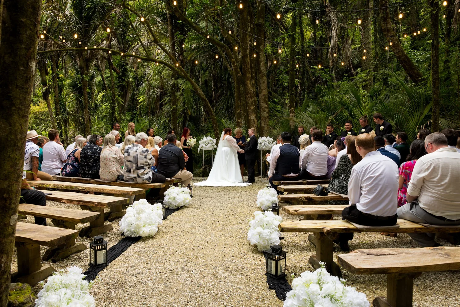 Guests watch the ceremony in the native bush at Bridgewater Estate