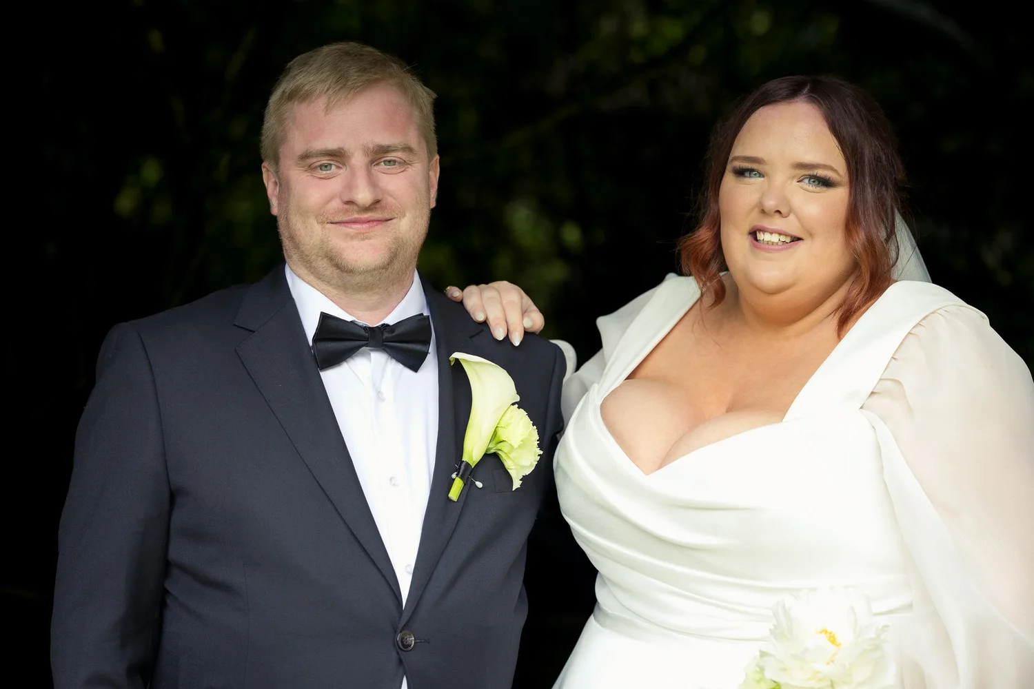 Leah and Warwick smile together after the ceremony