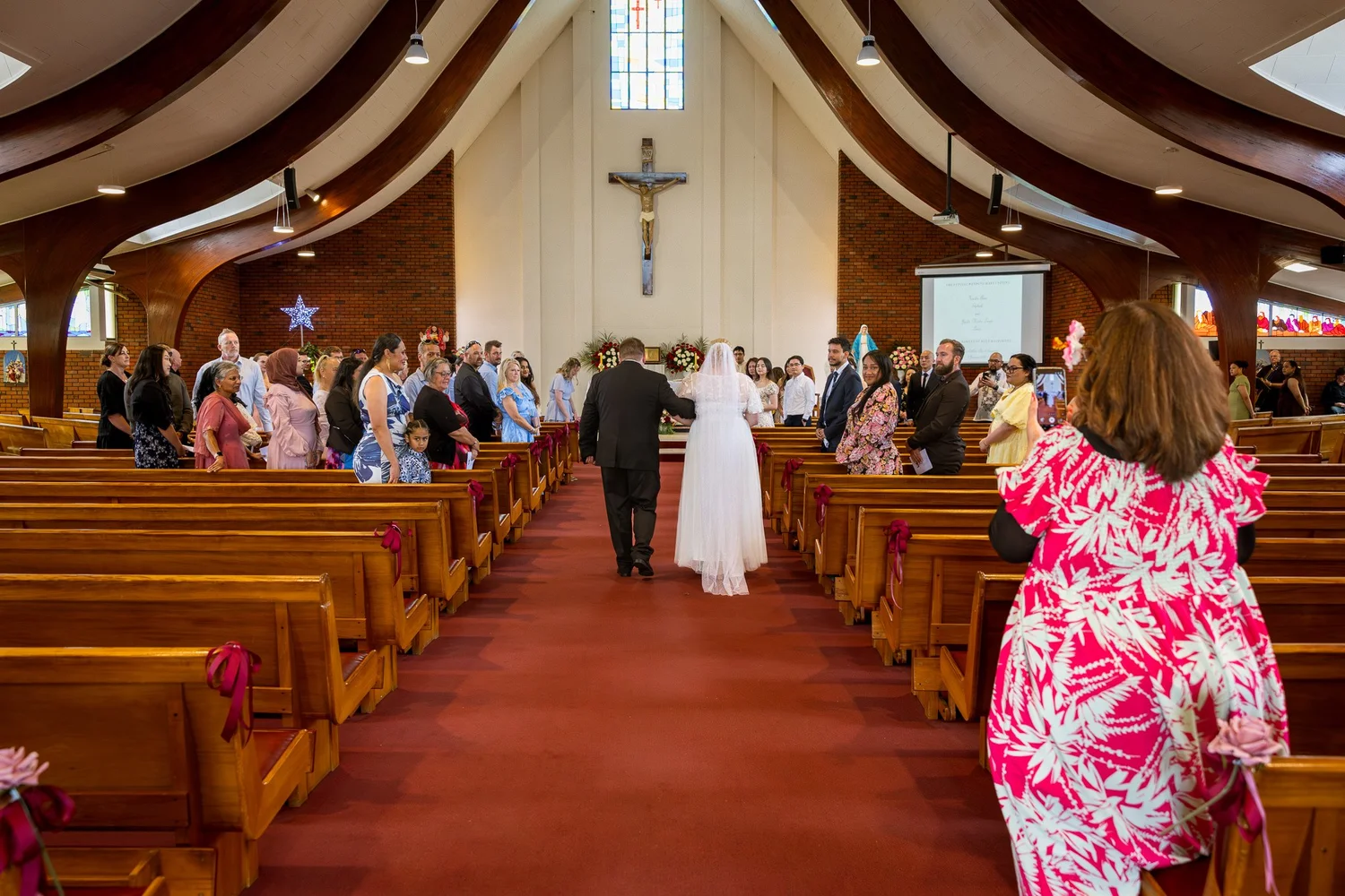 Kirstin is walked down the aisle by her uncle