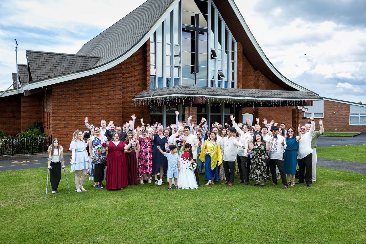 Guests wave and cheer outside the church