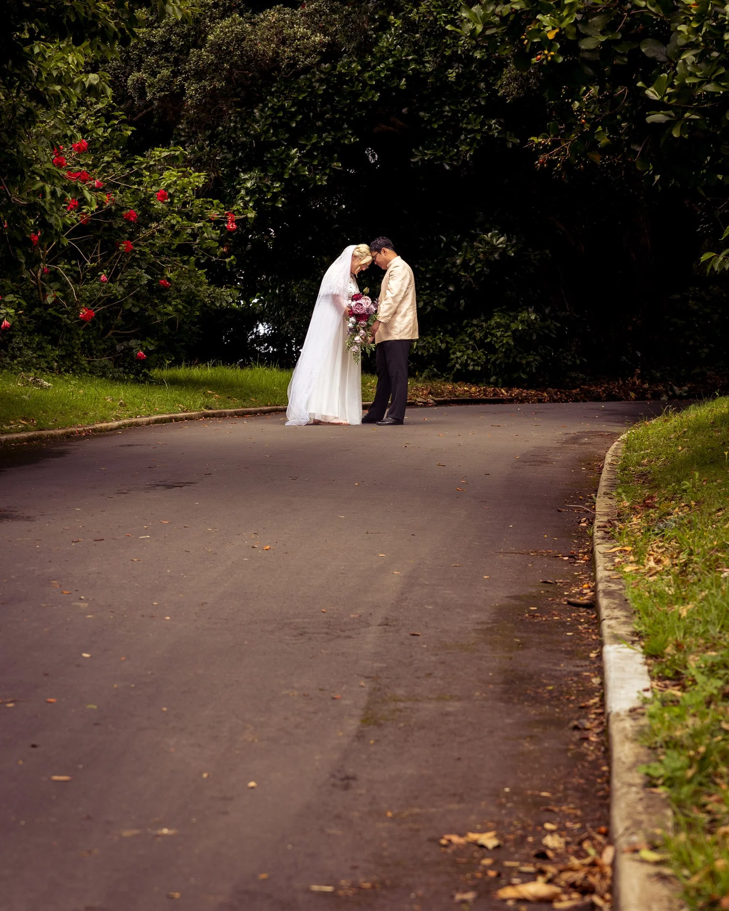 Kirstin and Justin kiss at the end of a curving path