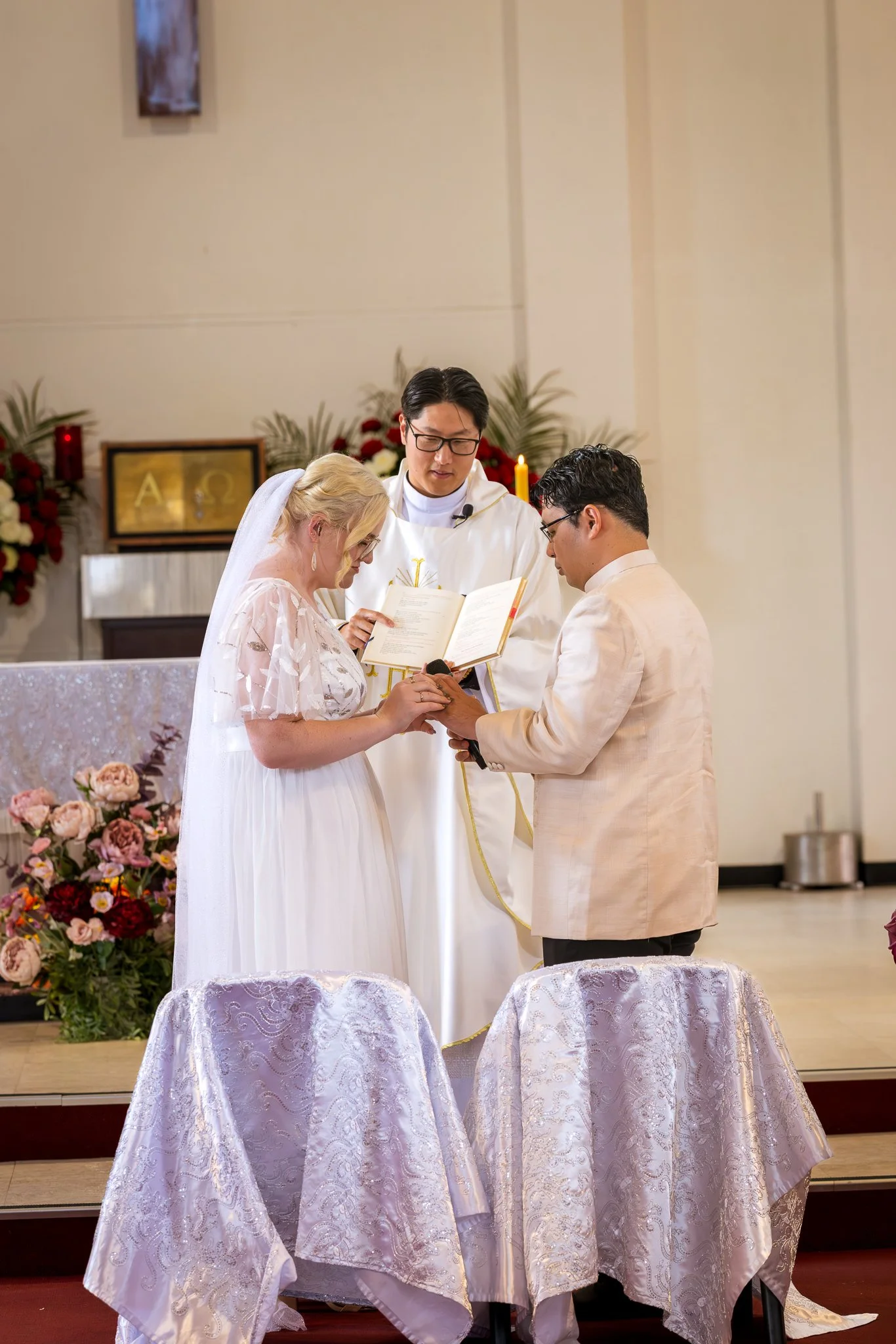 Kirstin and Justin exchange rings at the altar