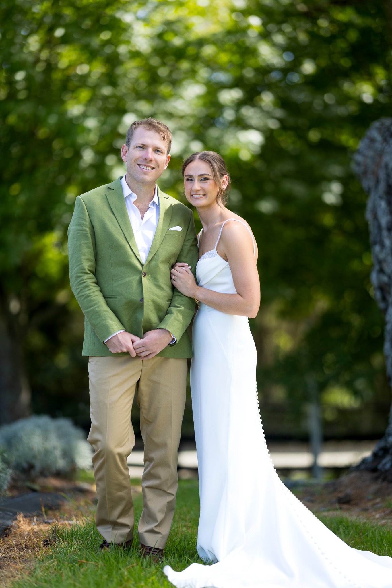 Jade and Ben stand together on the lawn