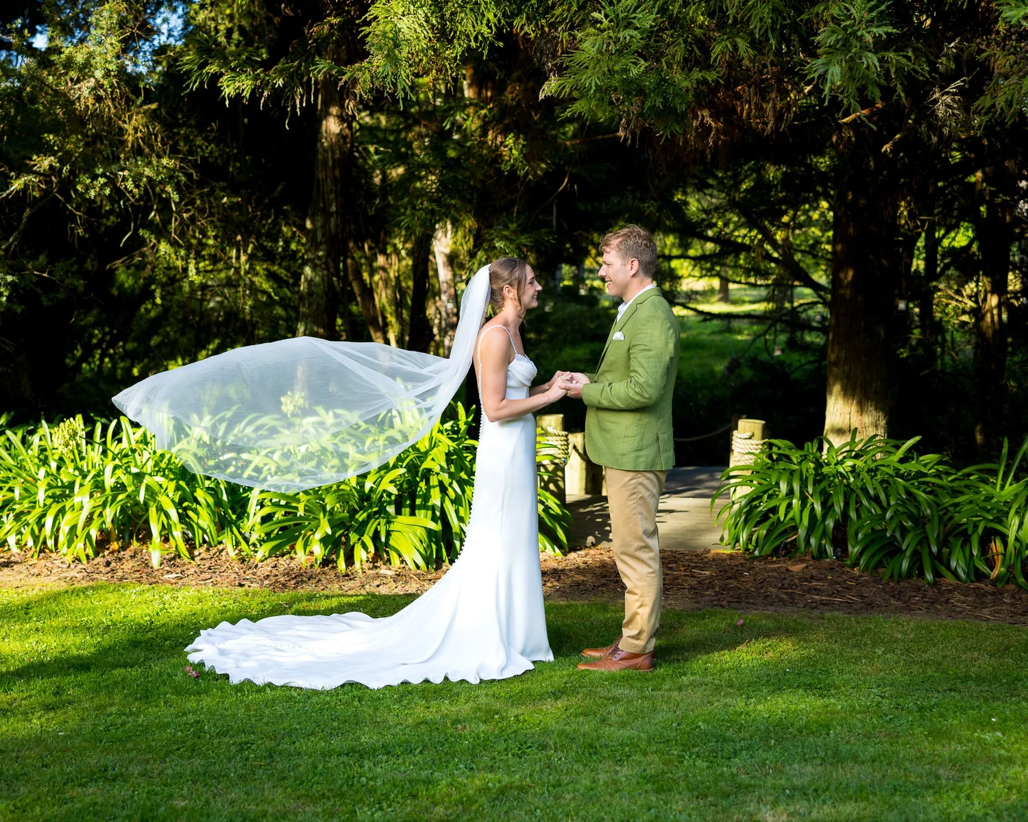 Jade's long veil floats in the breeze as she faces Ben