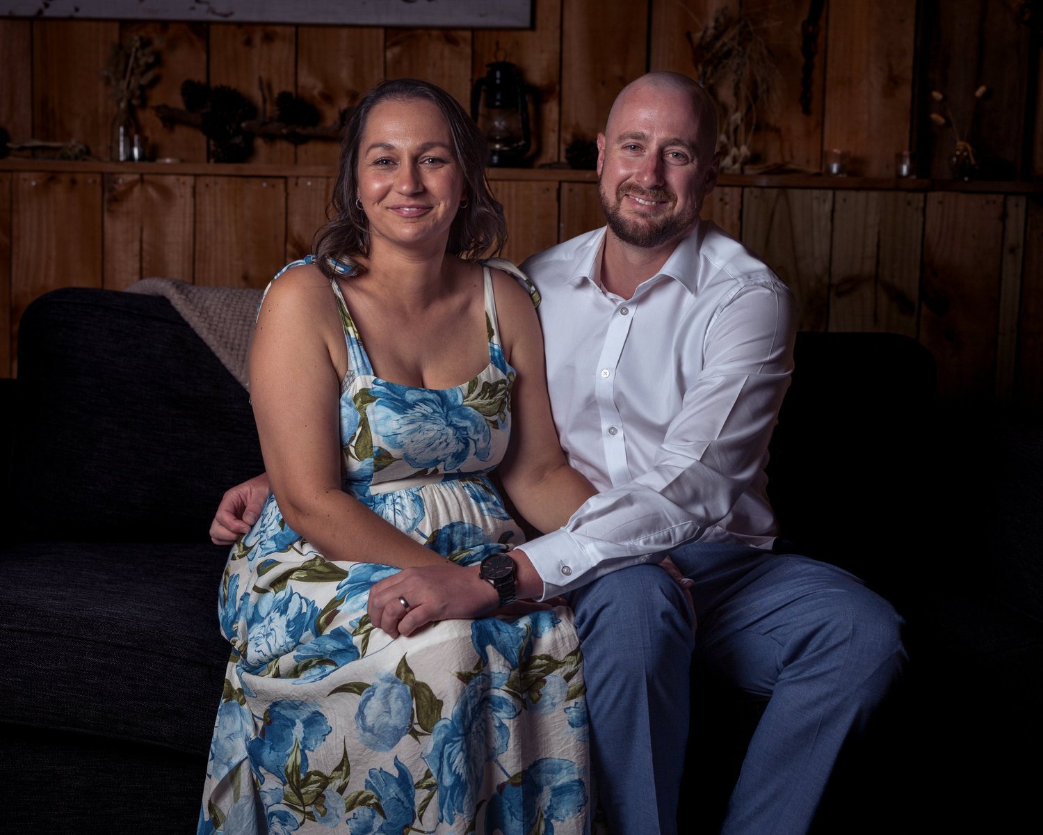 Two guests sit together for a portrait