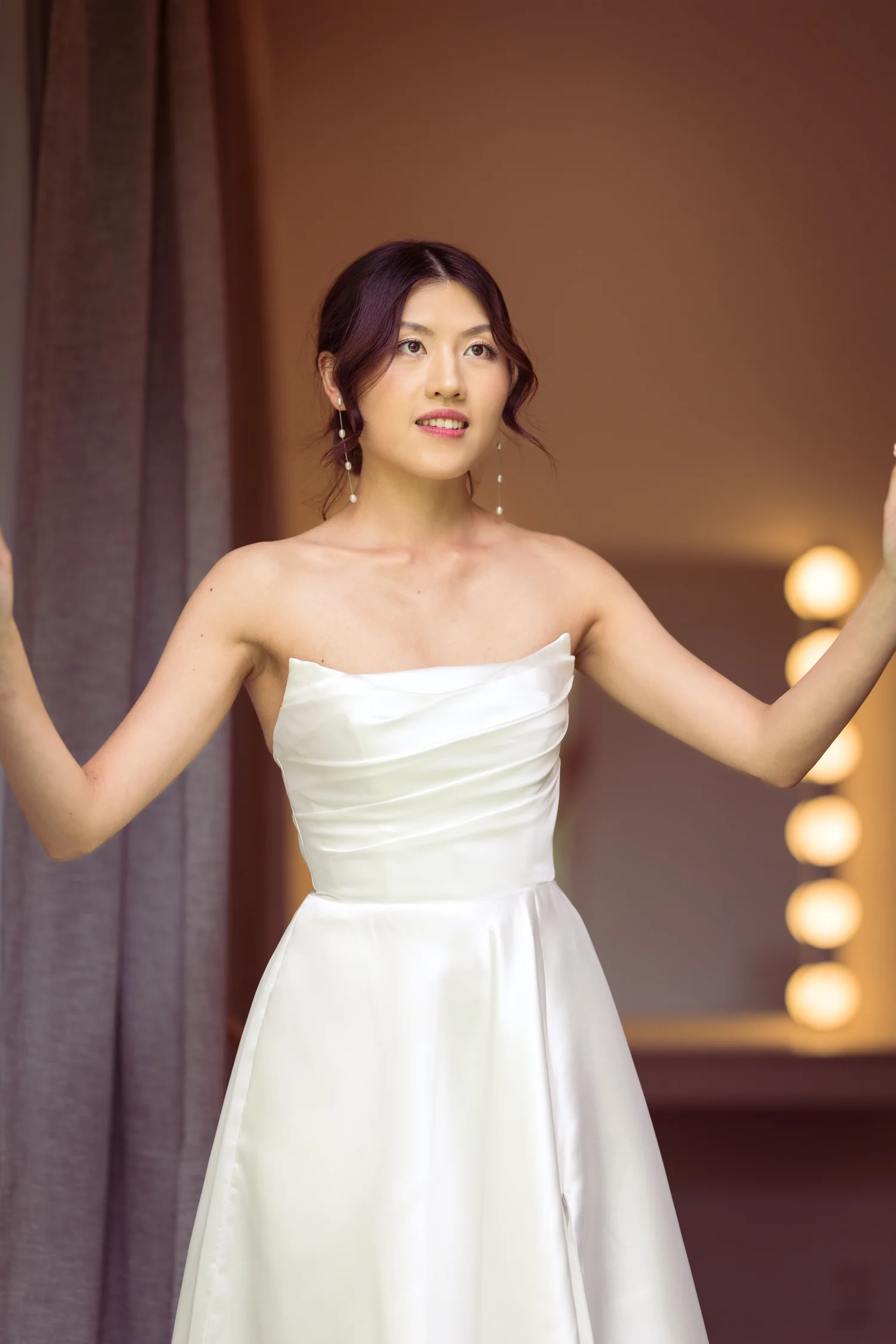 Cherry in her strapless gown in the bridal suite