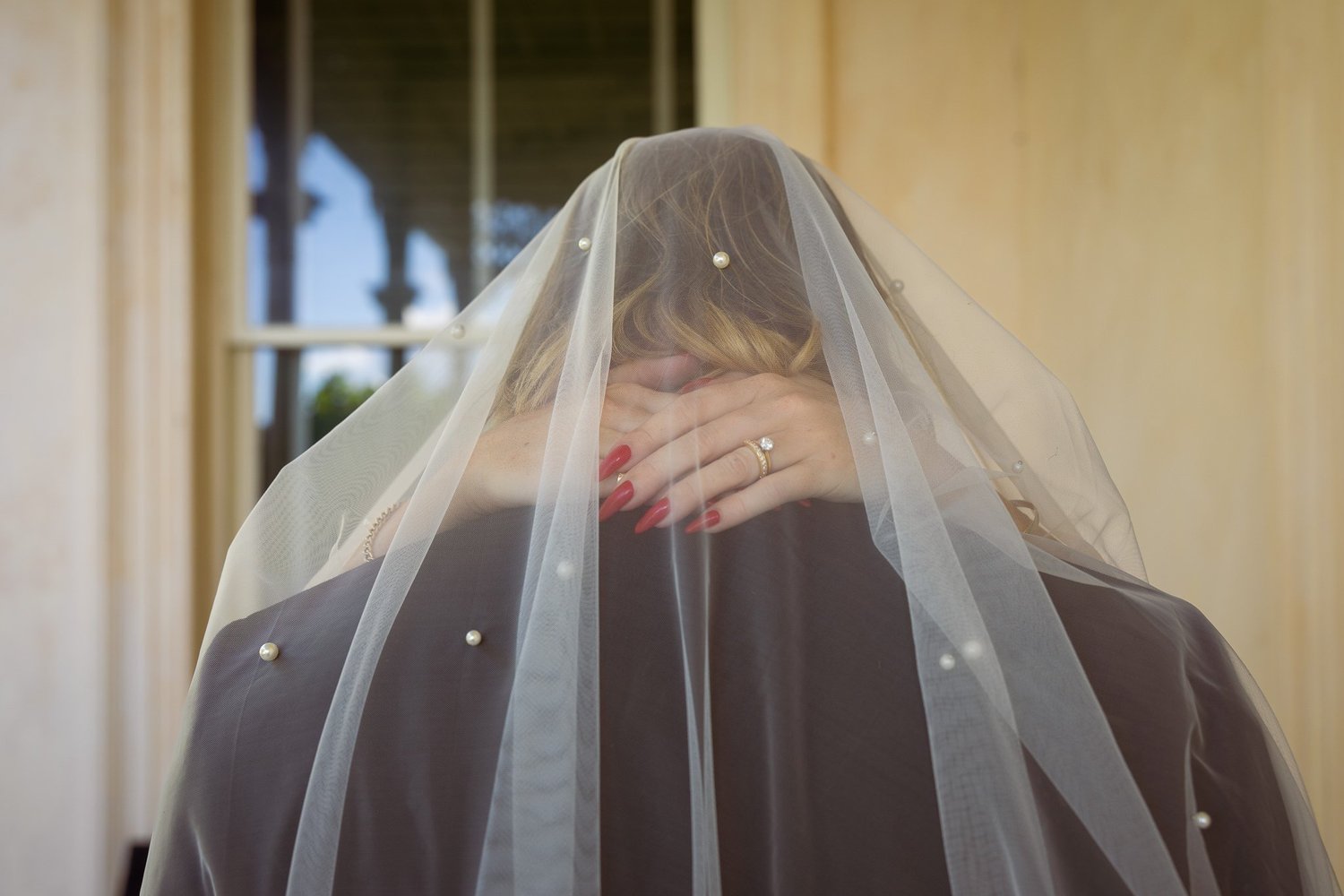 Chanel and Latham beneath her veil