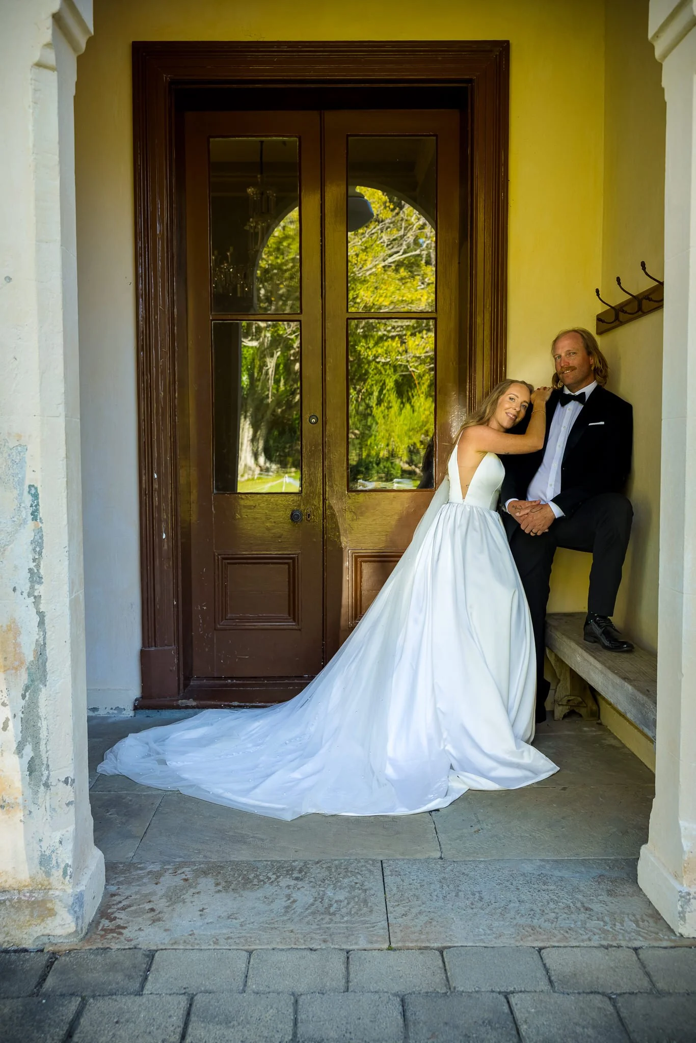 Chanel and Latham in the doorway of Mansion House on Kawau Island