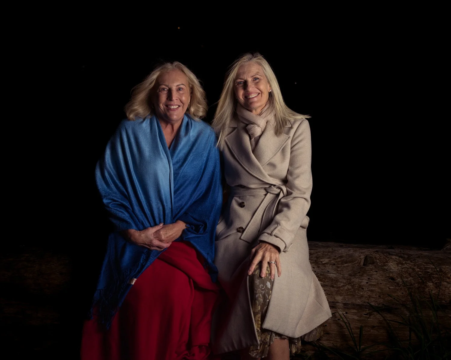 Two guests sit side by side for an evening portrait