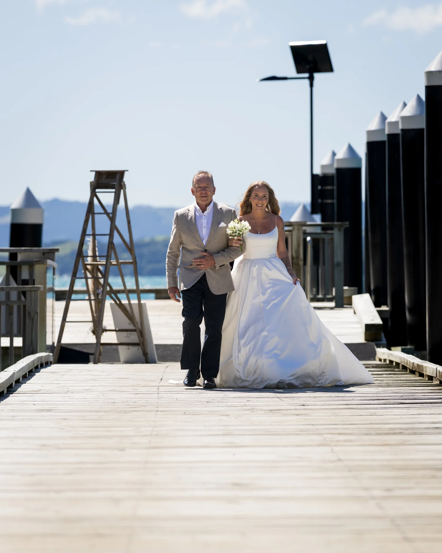 Chanel is walked along the wharf at Kawau Island