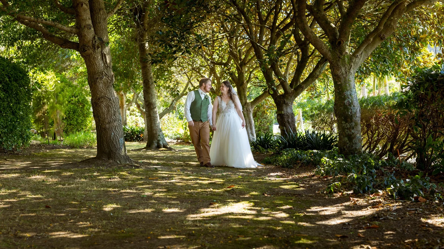 Mikaela and Dylan beneath an avenue of trees