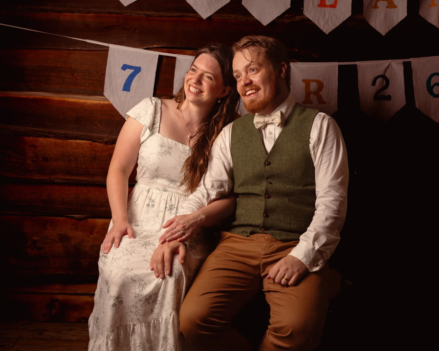Mikaela and Dylan seated together for an evening portrait