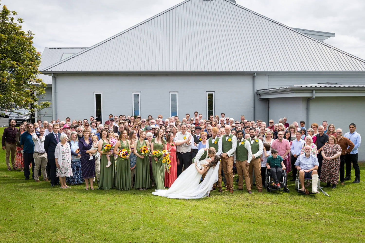 Mikaela and Dylan with all their guests outside The Barn Waimauku