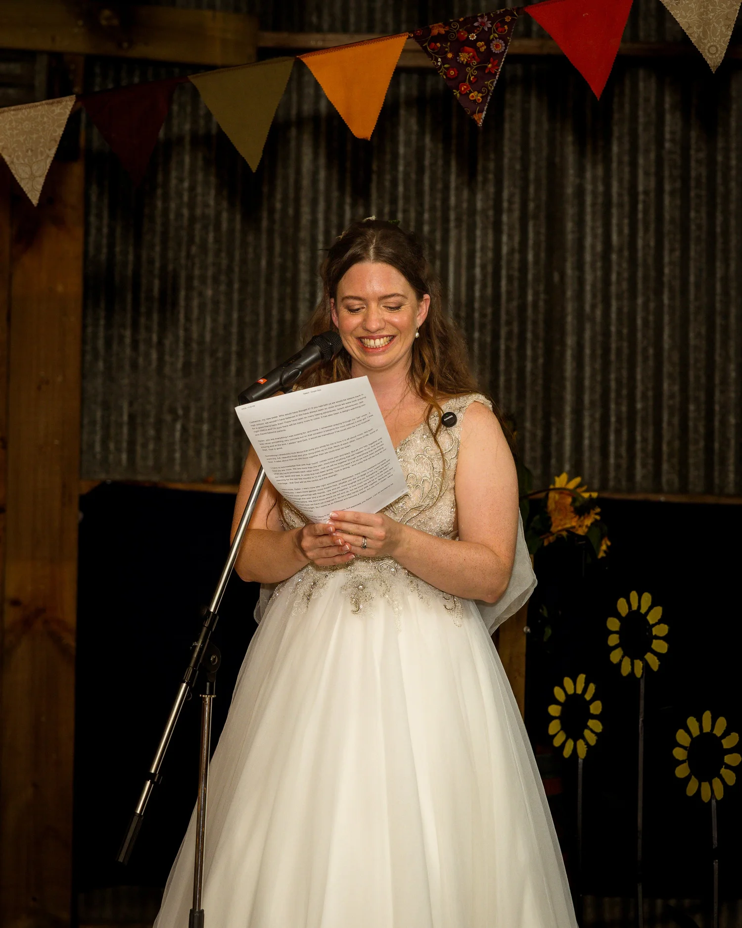 Mikaela reads her speech at the microphone