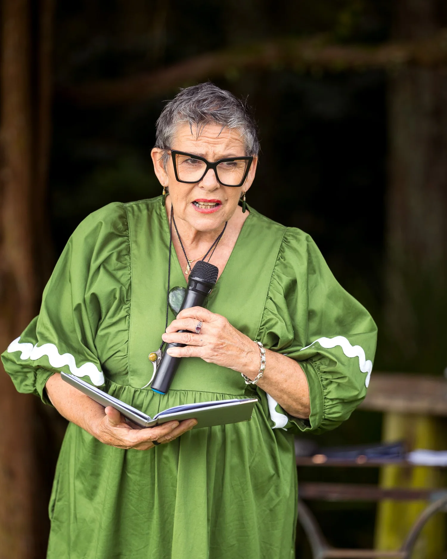 The celebrant speaks at the outdoor ceremony