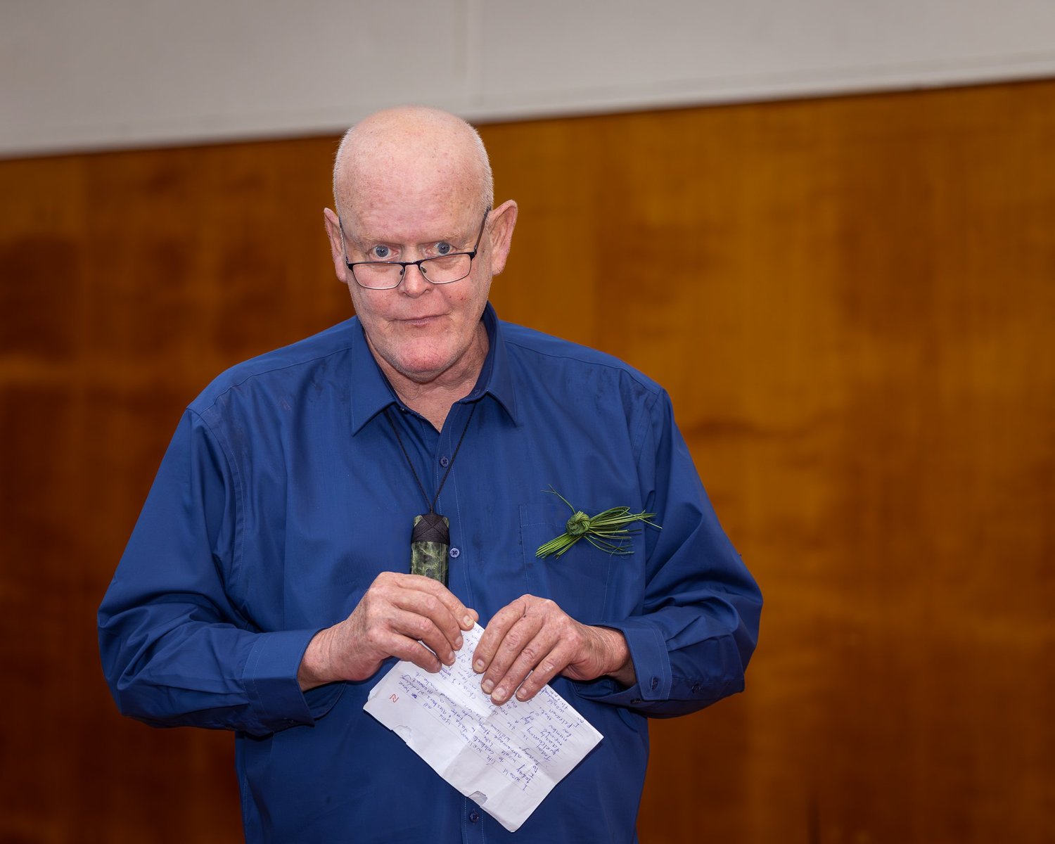 A guest reads his speech in the hall
