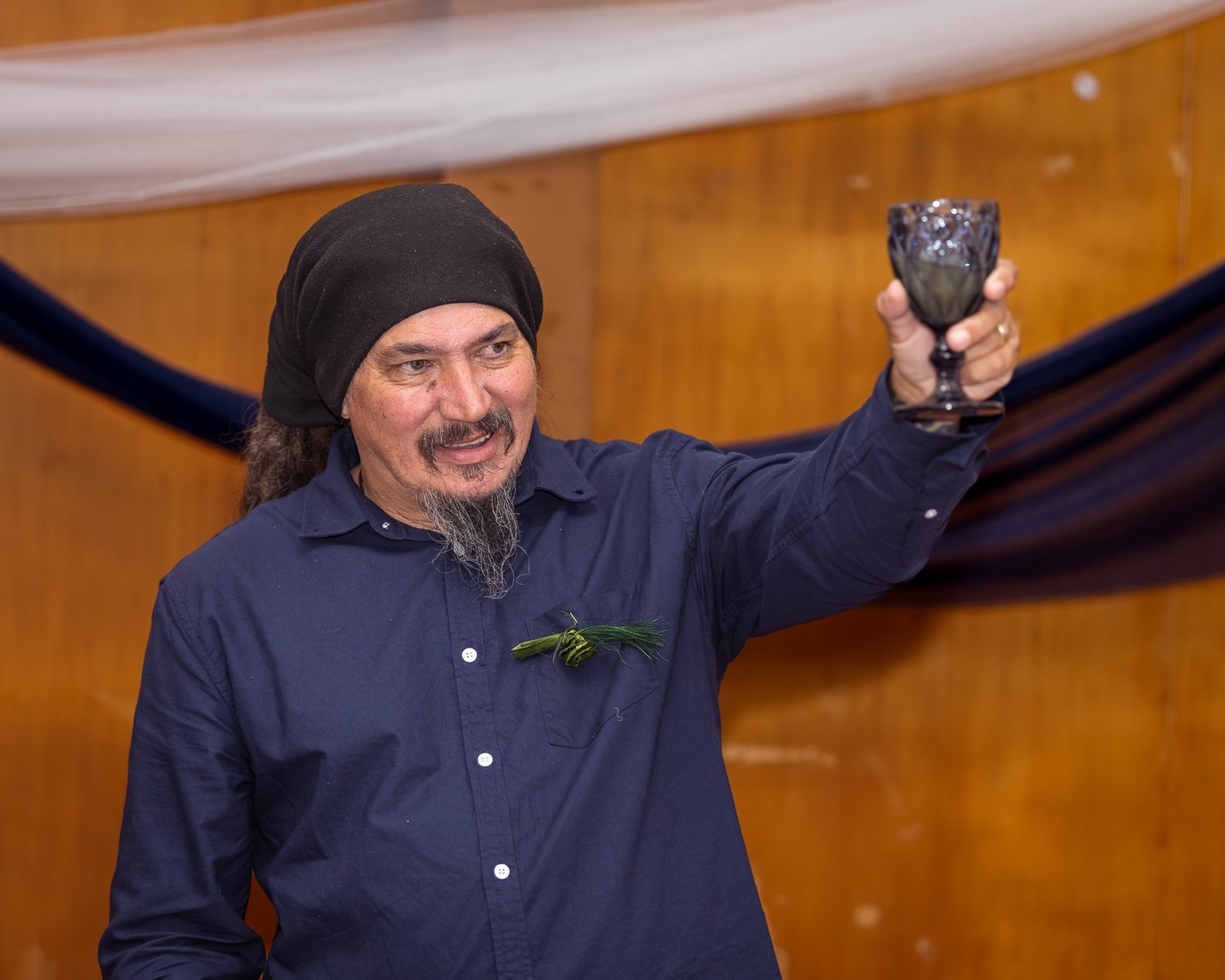 A guest raises his glass for a toast