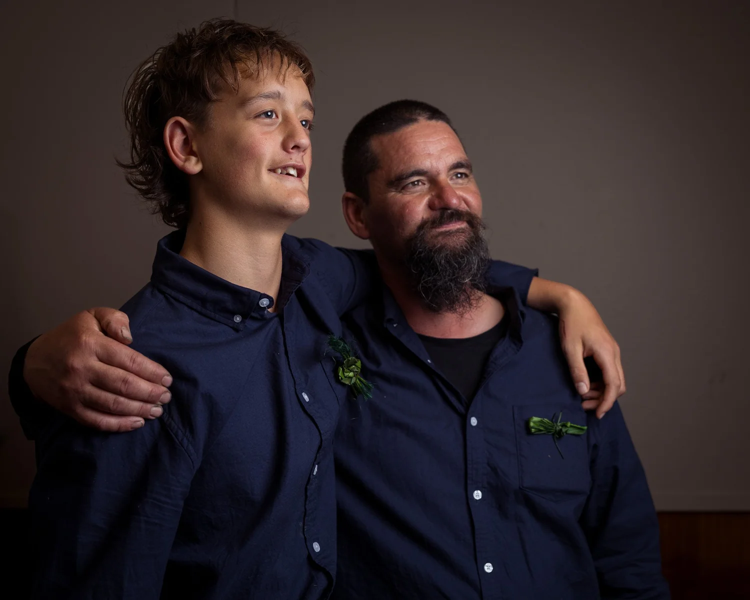 Alistair with his arm around a young guest for a portrait