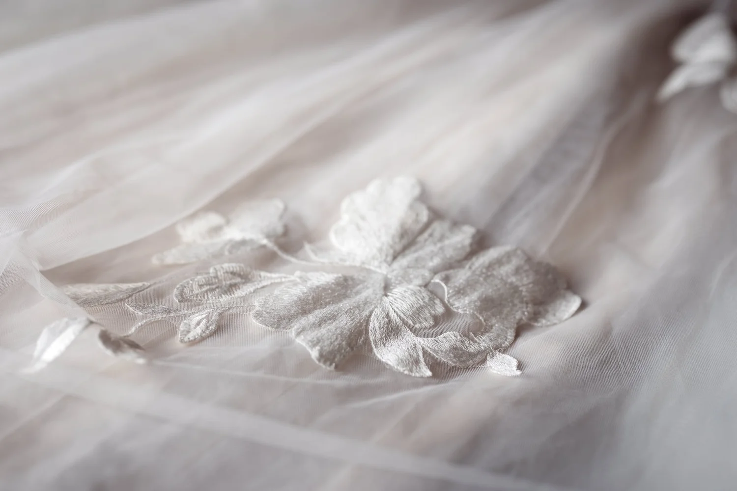 Close-up of the floral lace detail on Kayla's gown