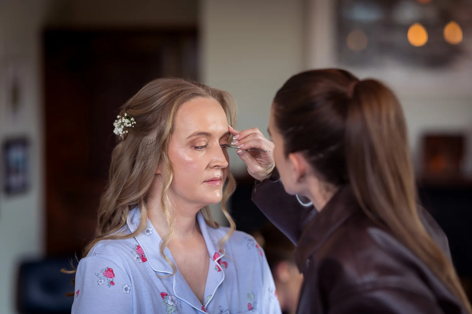 Kayla has her makeup touched up before the ceremony