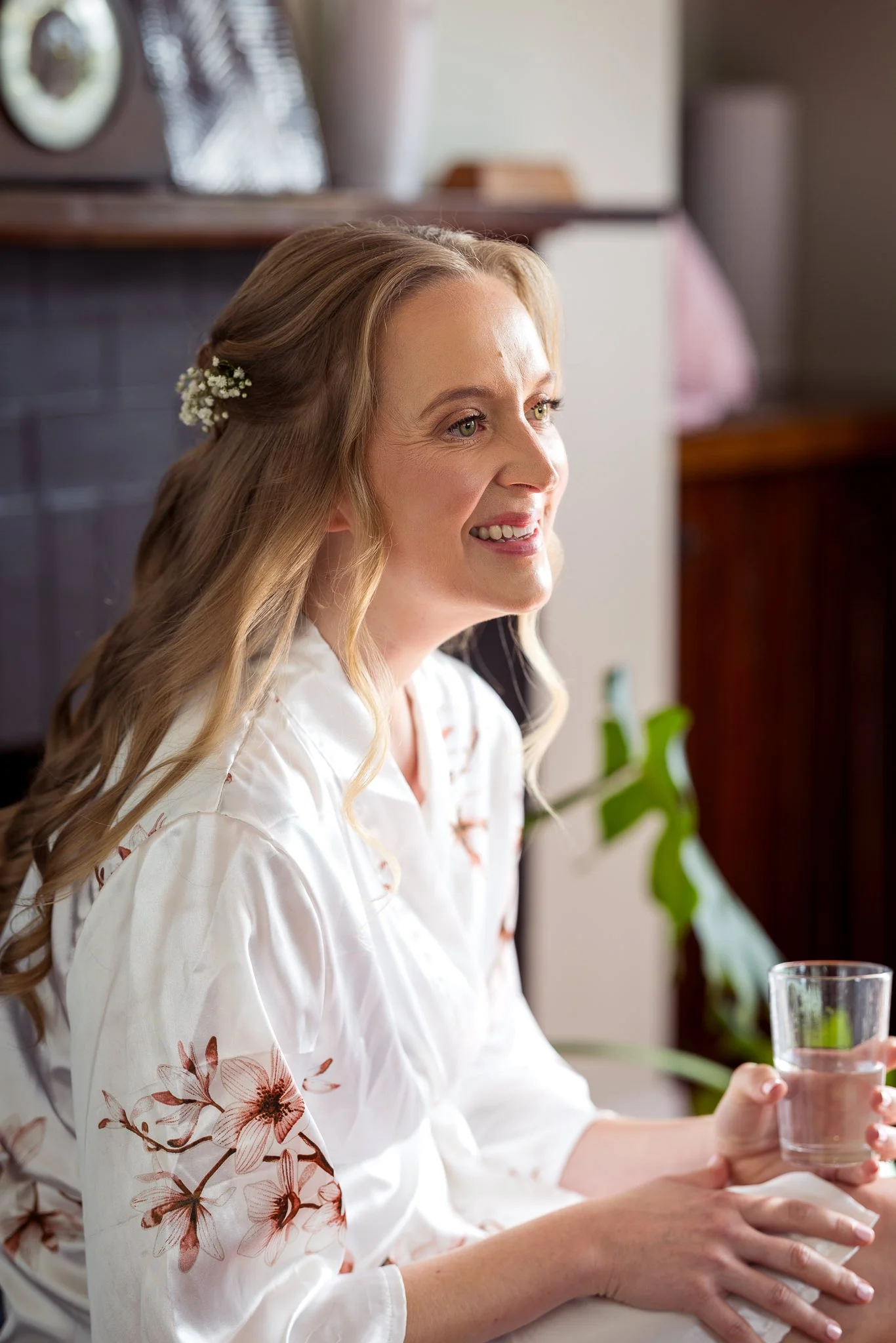 Kayla laughs in her robe during bridal preparations