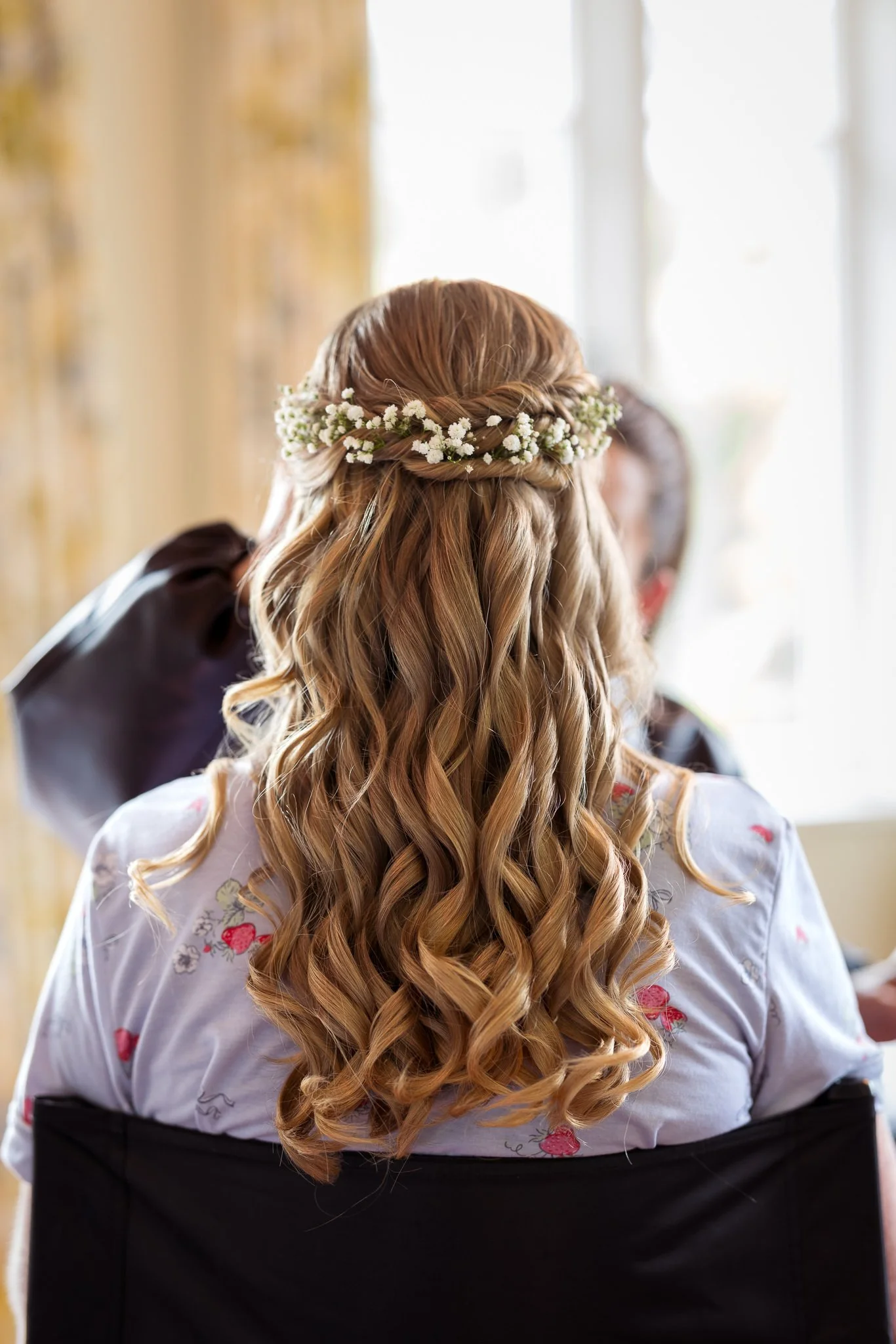 Kayla's long curls and hair vine from behind