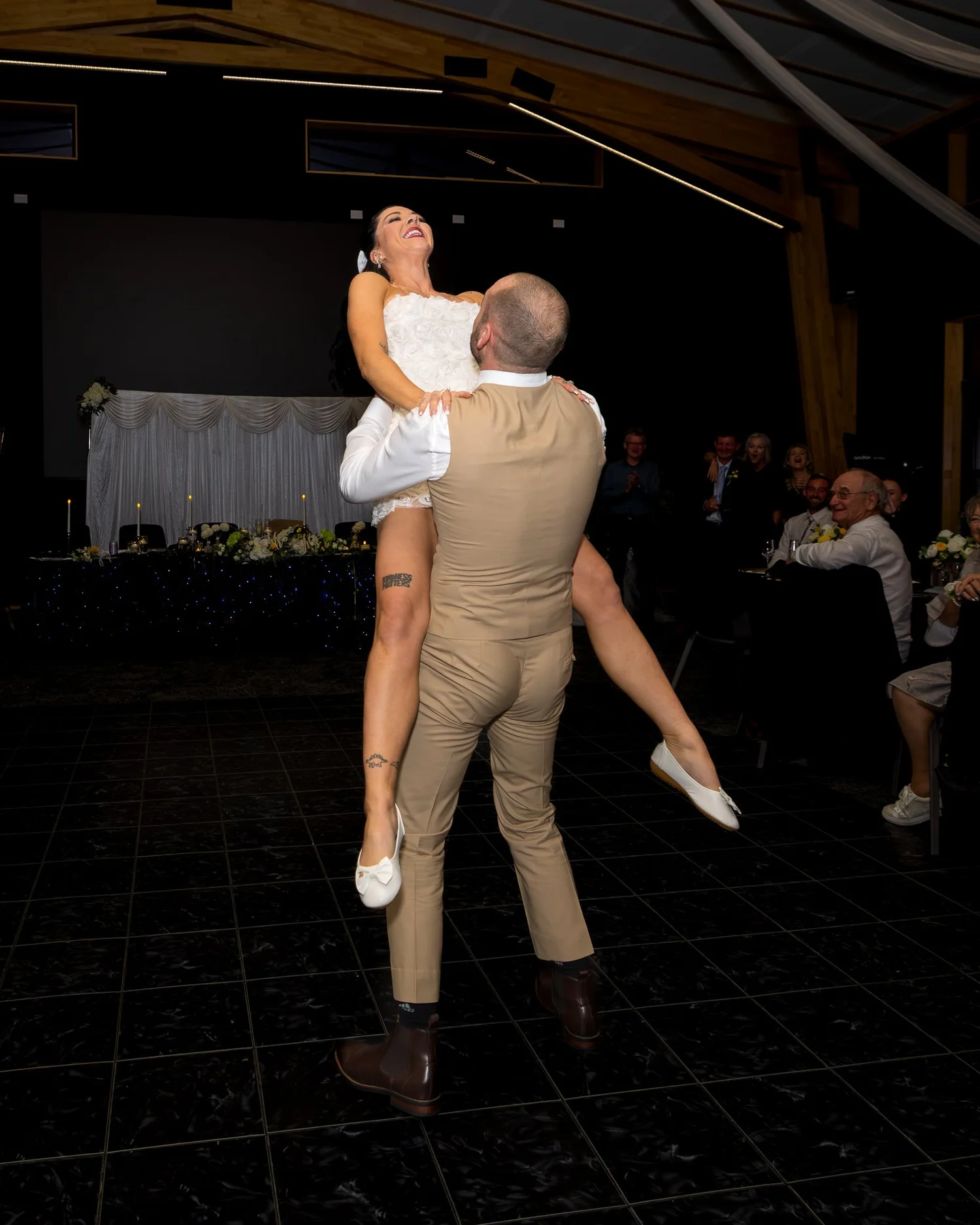 Corey lifts Emma high on the dance floor